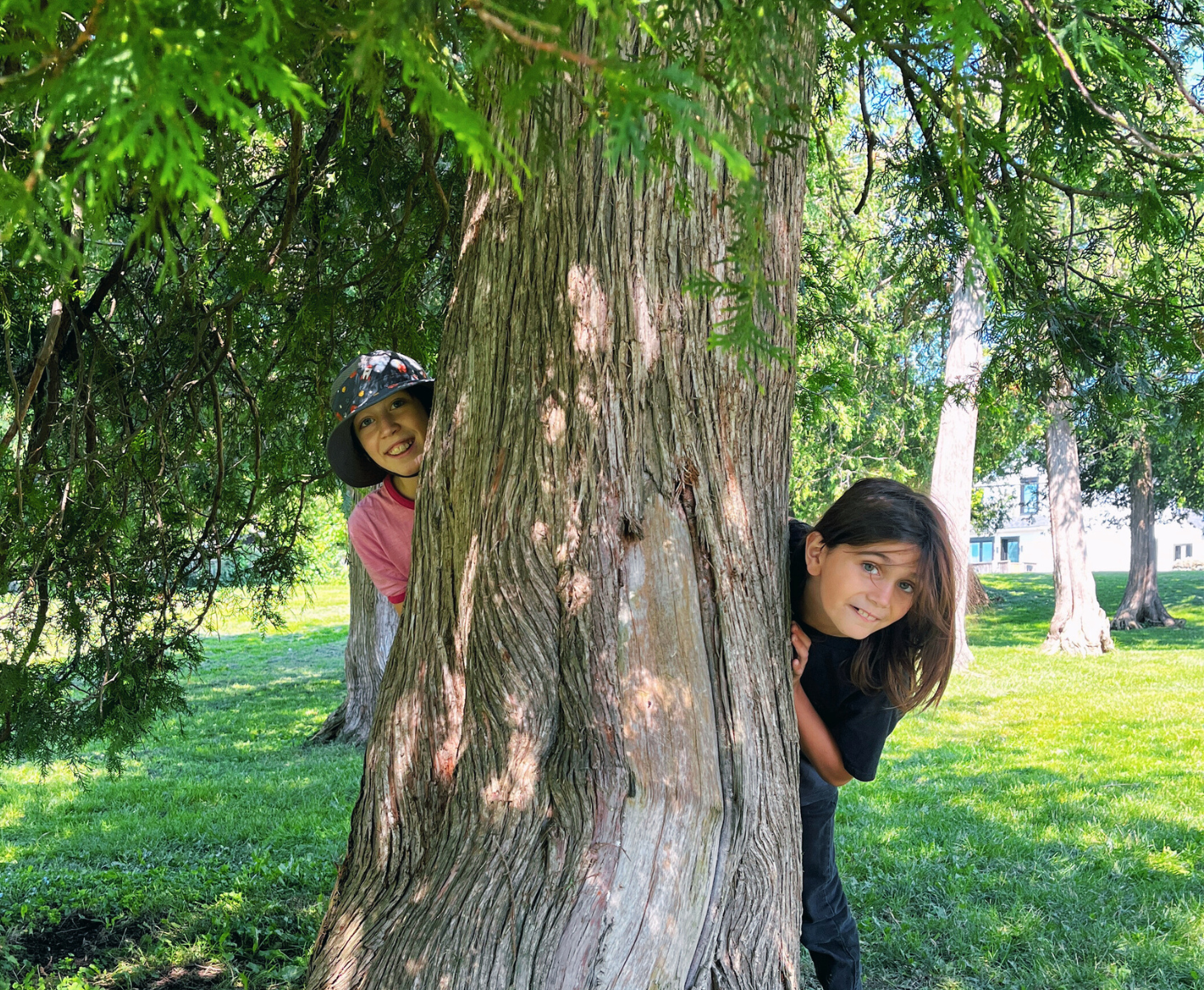 Two young students playing outdoors during musical summer camp.
