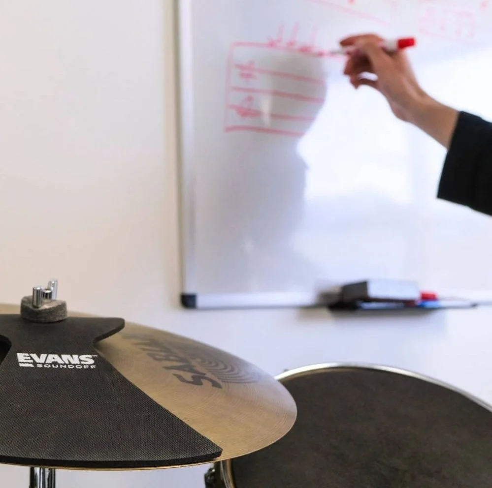 Our expert drum instructor preparing for children's drum class in Ayr