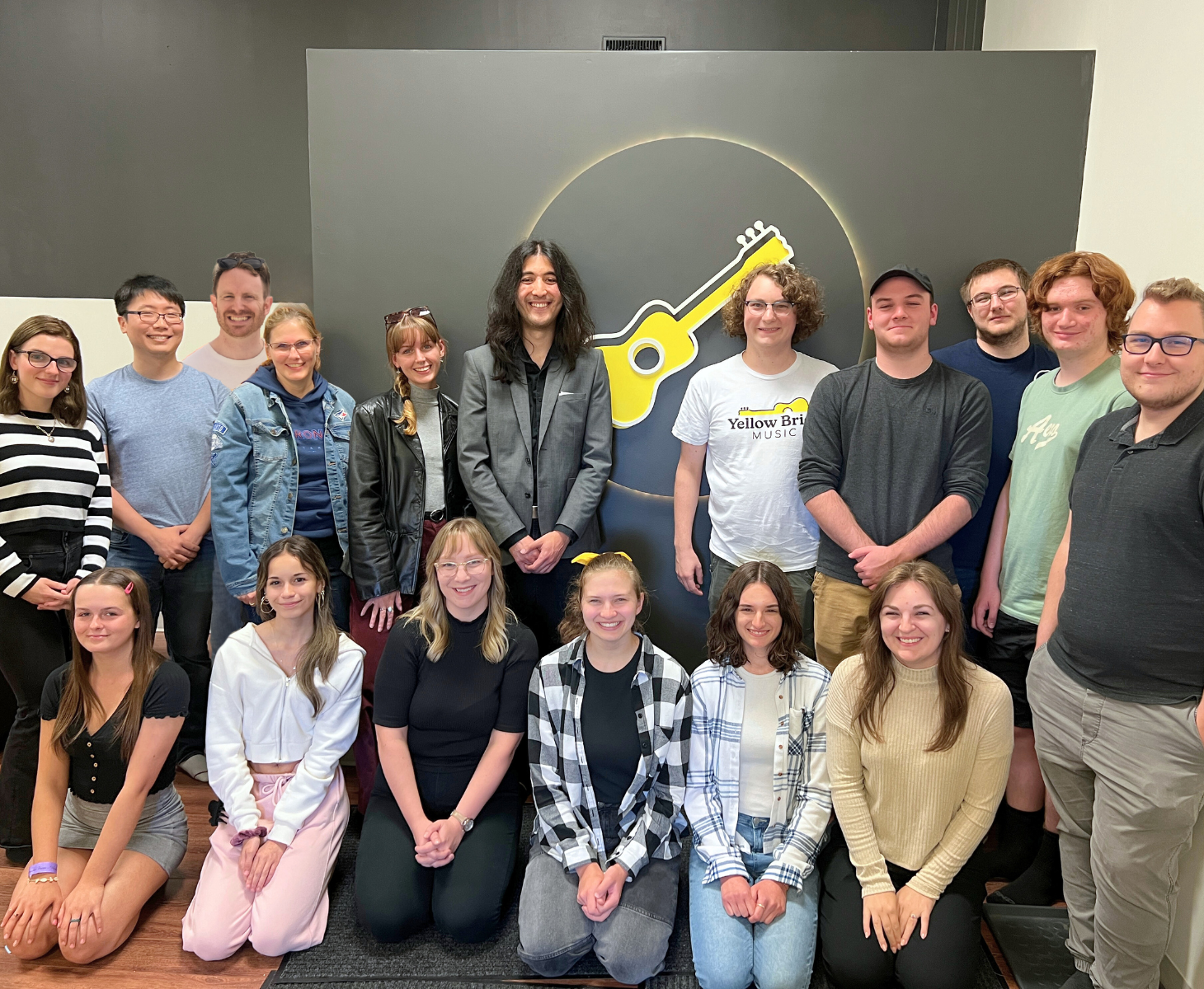 Group photo of the YBM staff at one of their studios