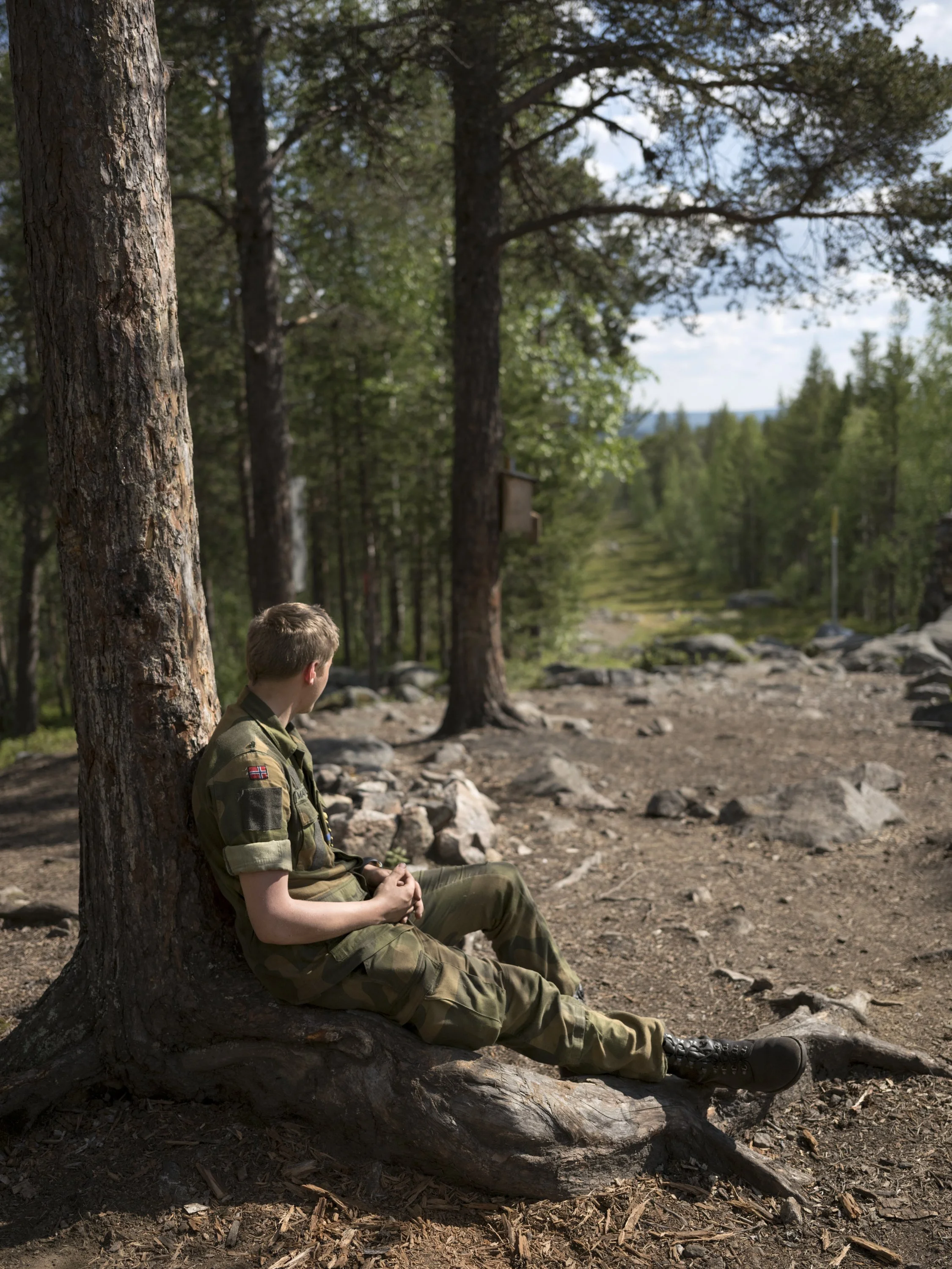 A Norwegian conscript takes a break while watching the Russian/Finnish/Norwegian
border, at Treriksrøysa three-border zone