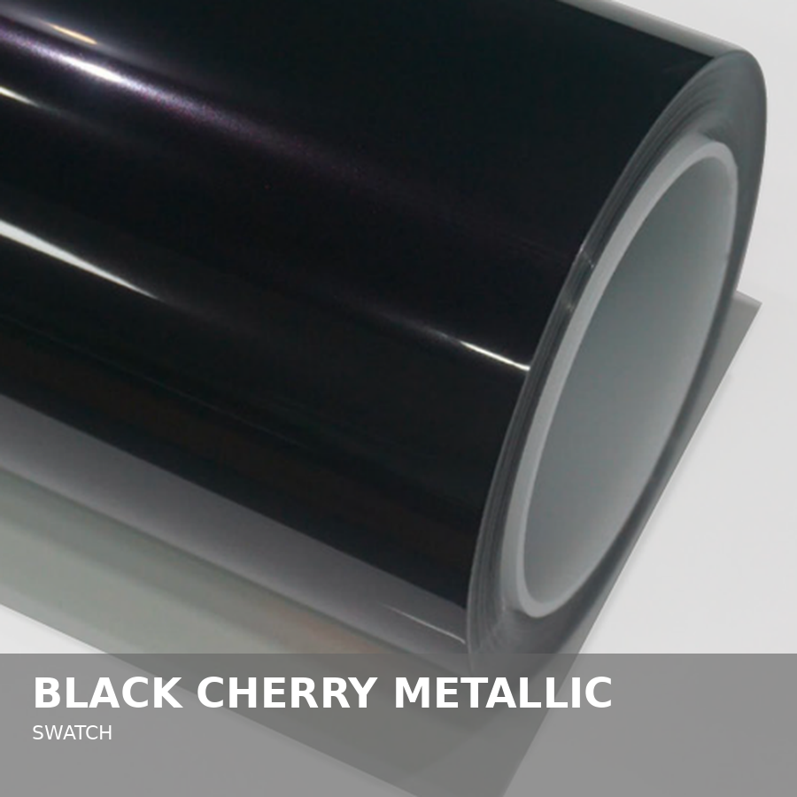 Close-up of a black cherry metallic Swatch watch with a cylindrical shape and metallic finish.