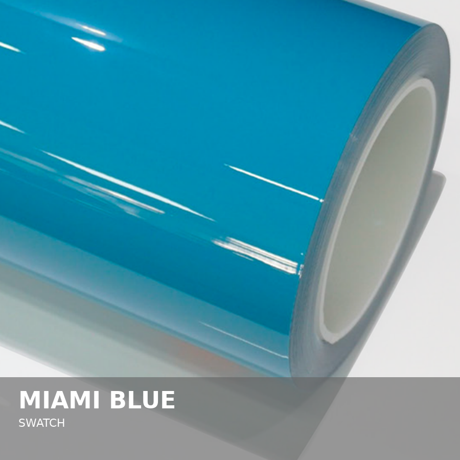 A roll of glossy Miami Blue-colored vinyl or wrapping film on a white surface.