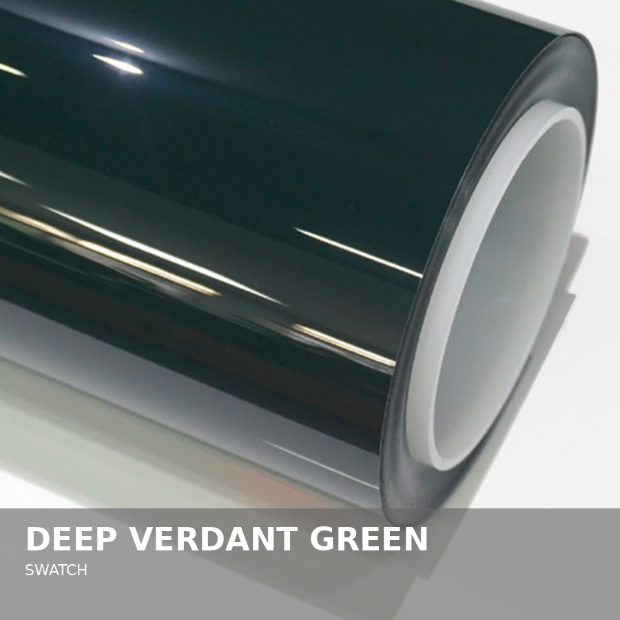 Close-up photograph of a Swatch wristwatch in deep verdant green color with a black strap and silver-tone bezel.