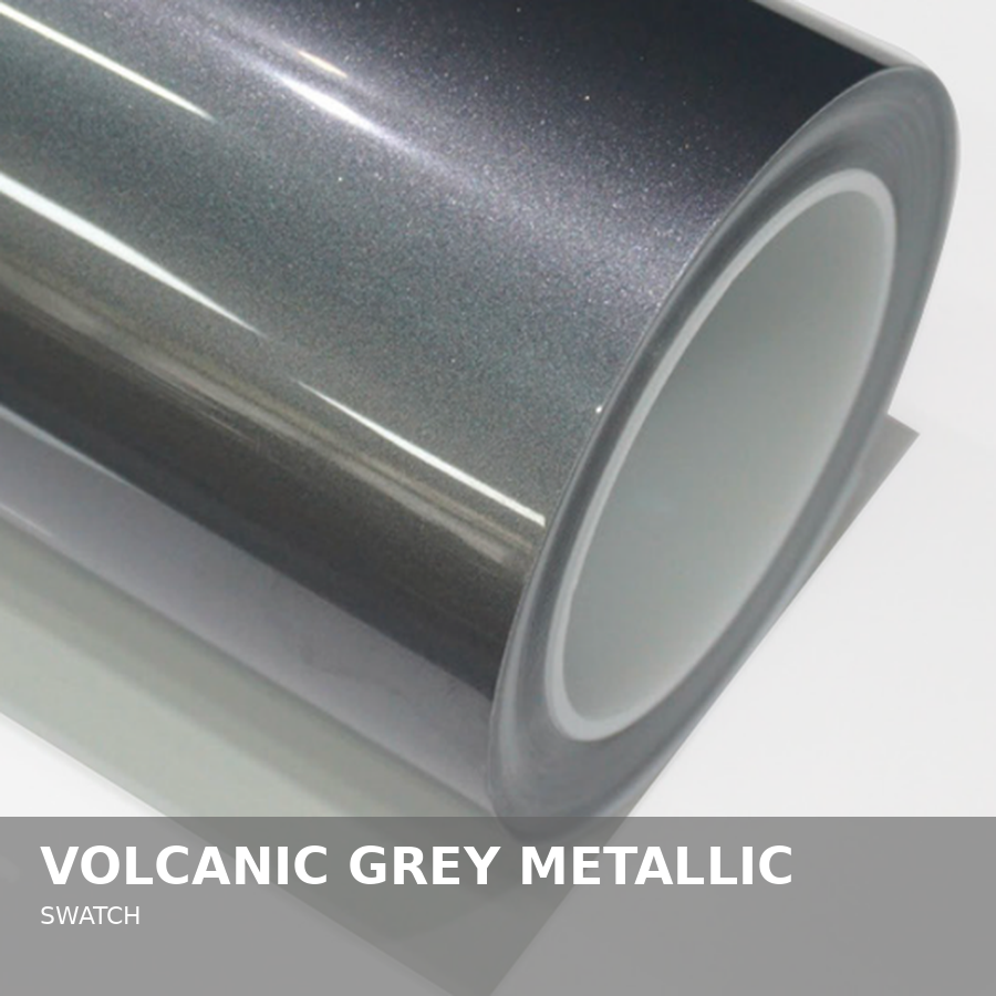 Close-up of a roll of metallic grey vinyl wrap with a smooth, shiny surface.