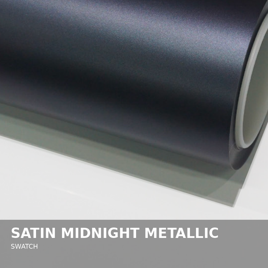 Close-up of a satin midnight metallic swatch of material or paint, showcasing a smooth, slightly shimmery surface in dark grayish-blue color.