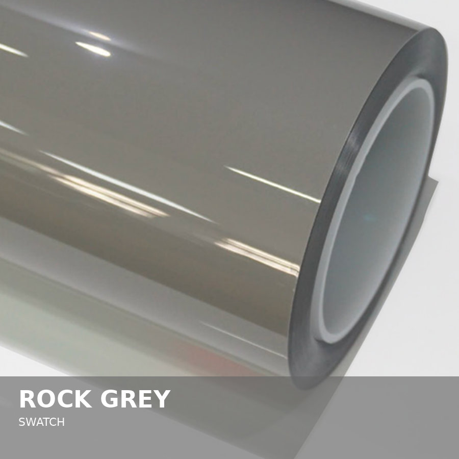 A metallic cylindrical object with a smooth, shiny surface reflecting light, labeled as 'Rock Grey.'