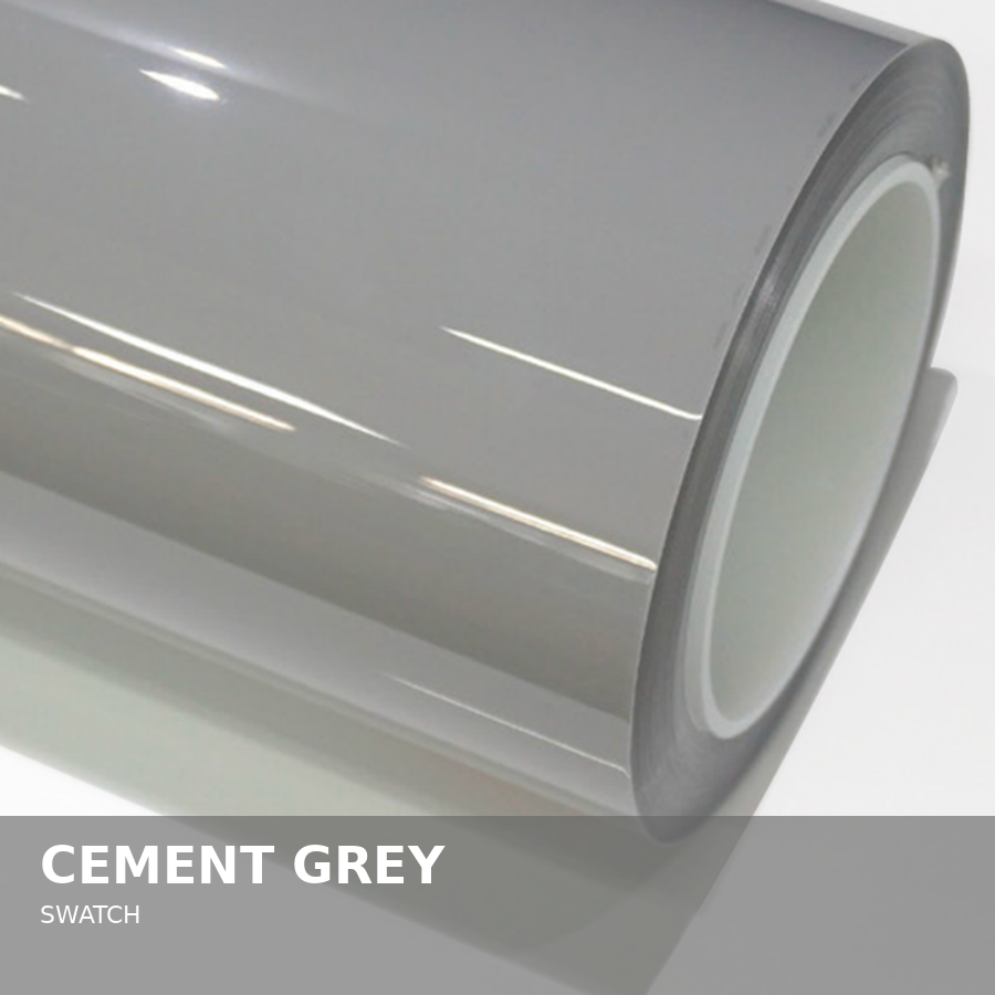 Close-up of a roll of cement grey adhesive film with a glossy finish.