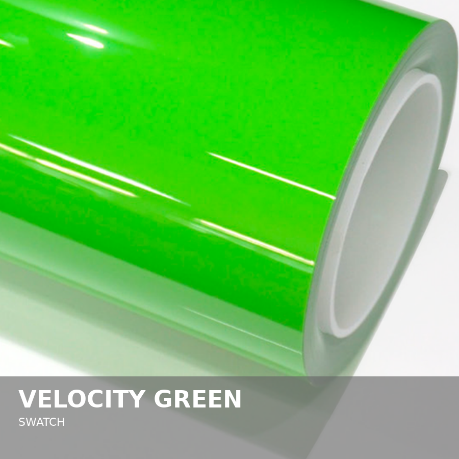 Close-up of a roll of bright green adhesive vinyl film.