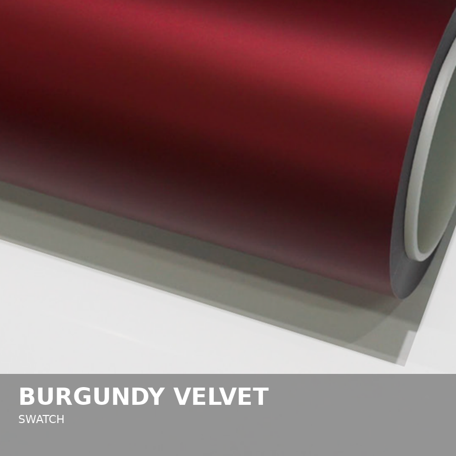 Close-up of burgundy velvet fabric roll on a white background with a gray label reading 'Burgundy Velvet Swatch'.