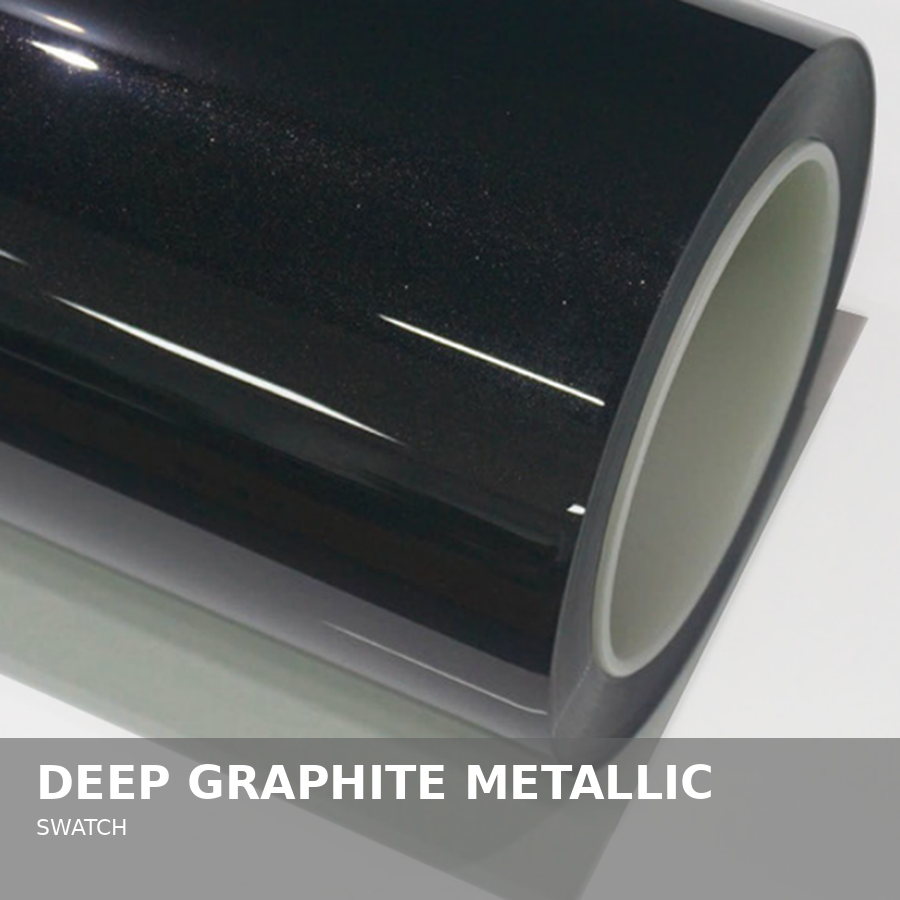 Close-up of a cylindrical speaker with a deep graphite metallic finish.