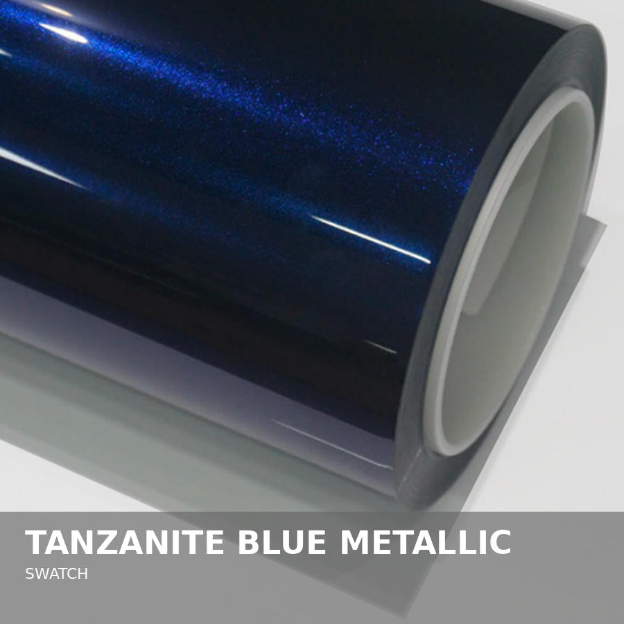 A roll of tanzanite blue metallic vinyl film on a white surface.