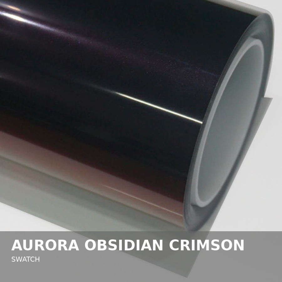 Close-up of a cylindrical device with a glossy, dark, iridescent surface called Aurora Obsidian Crimson, labeled as a swatch.