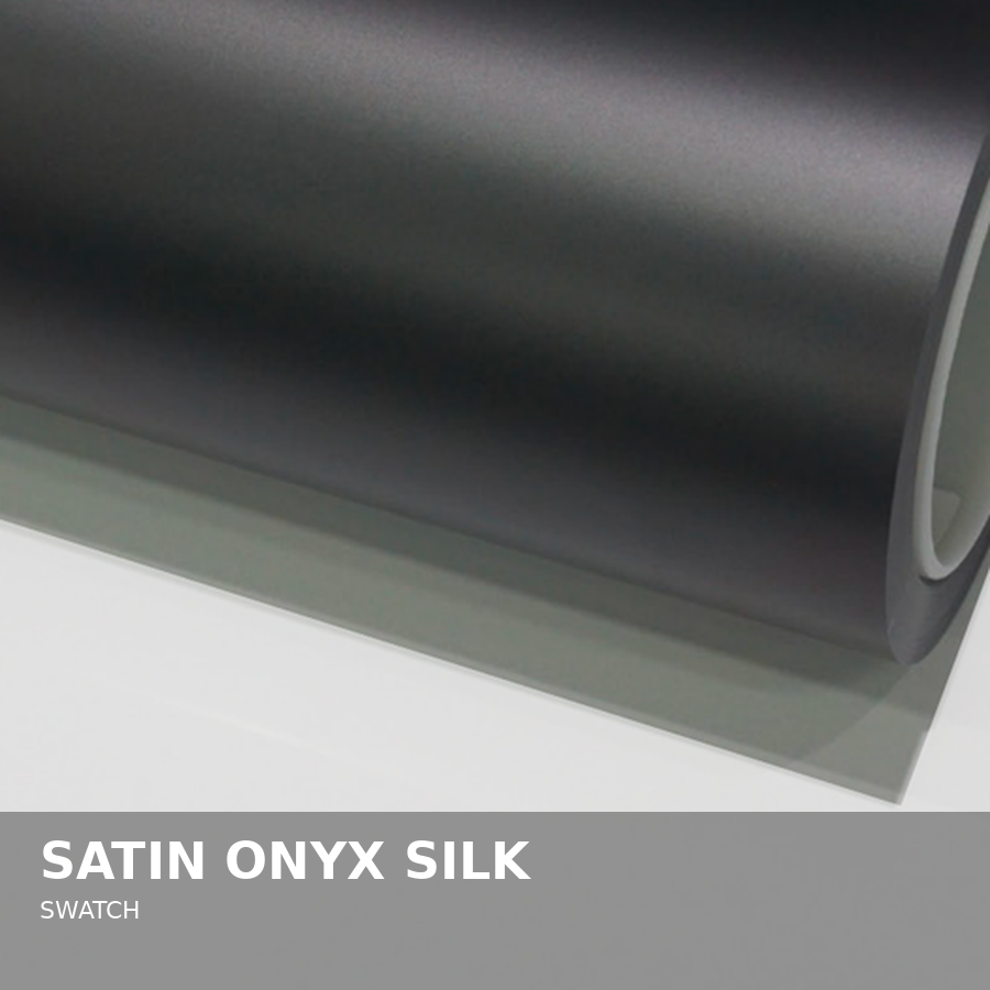 A roll of satin onyx silk swatch fabric.