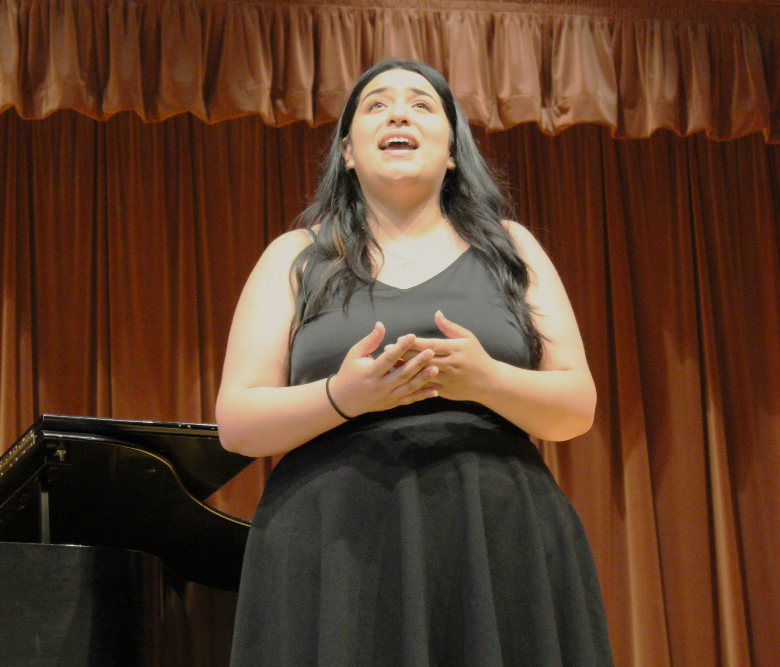 Jocelyn Singing Closeup with Hands.jpg