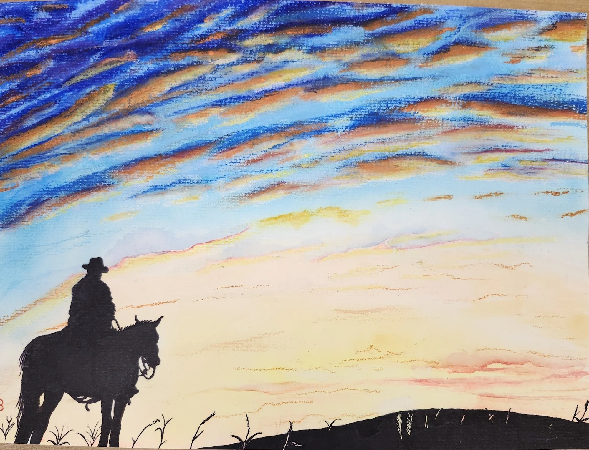 A vivid sunset, with the silhouette of a line cowboy on horseback in the foreground. The sky is in deep blues, pinks, yellows, and whites.
