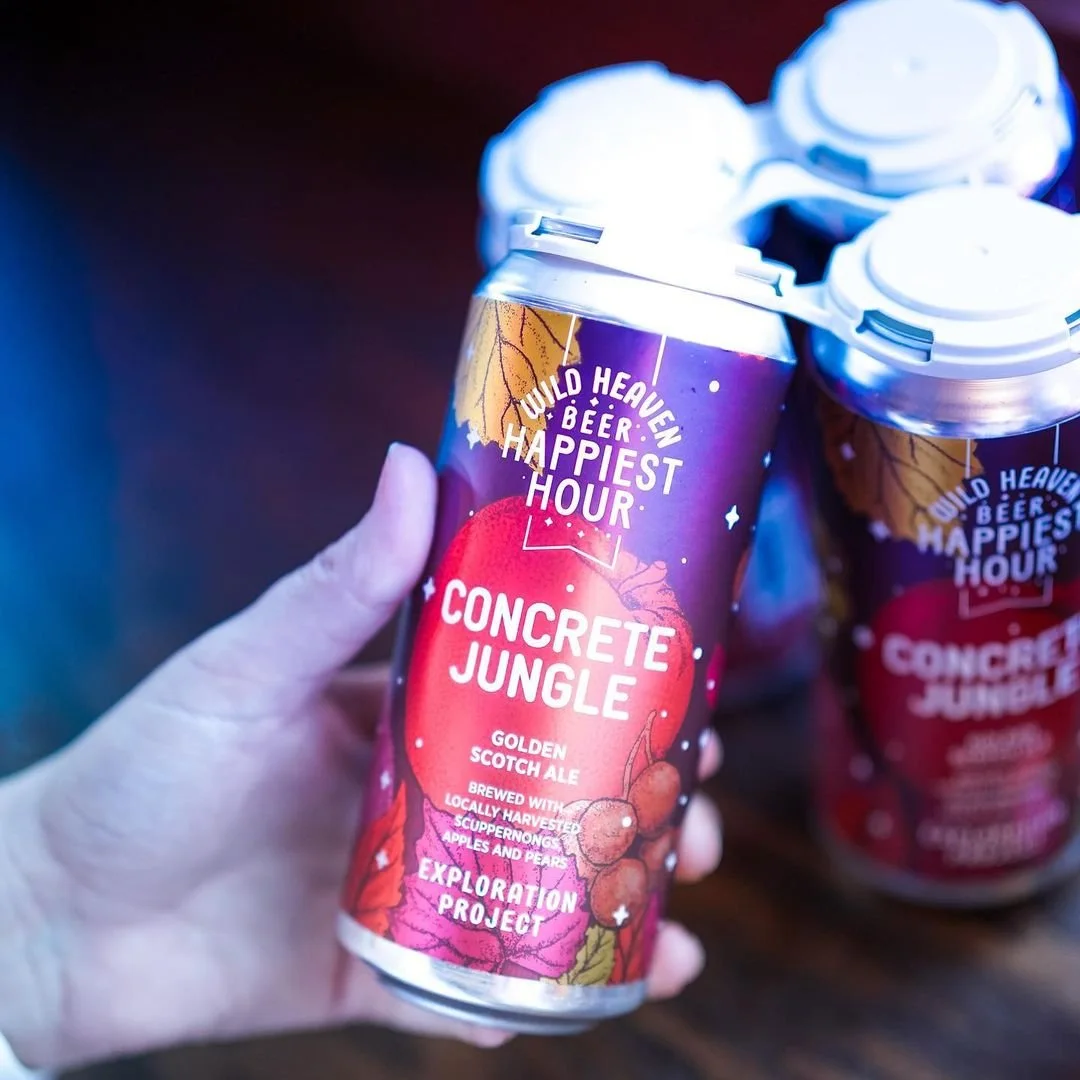 A beer label for Concrete Jungle showing an autumn scene with apples, autumn leaves, and muscadine