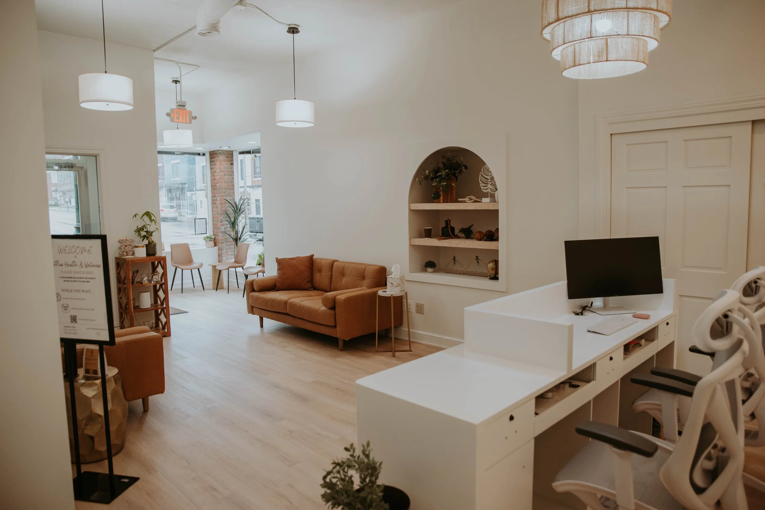 Welcoming front desk and waiting room at Atlas Health & Wellness medical practice