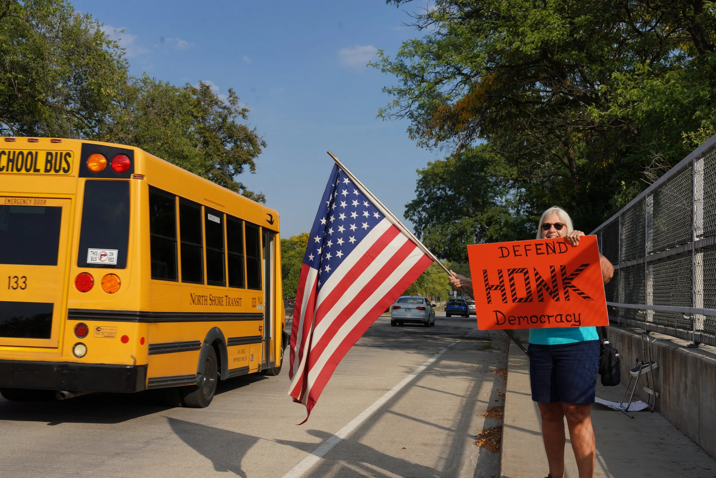 Around 25 protesters demonstrated at the Church Street location in Skokie on Friday afternoon.
