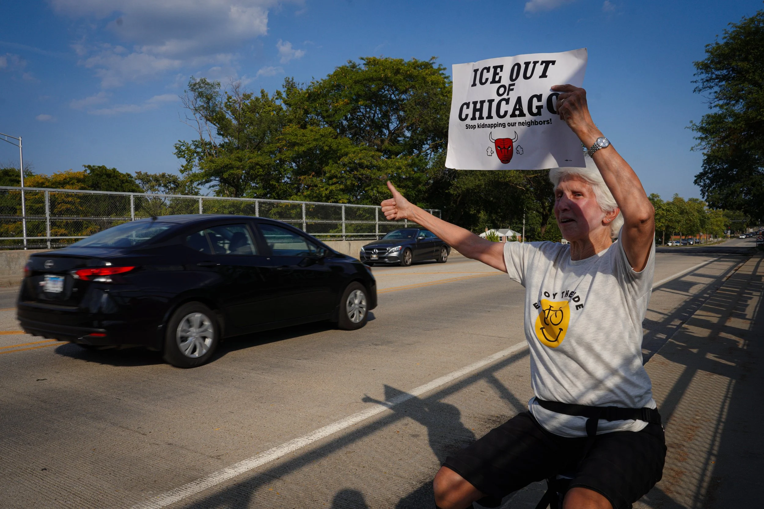 Evanston resident Joanne Davis held up a sign toward the oncoming cars on Church Street, holding up a thumbs-up sign or cheering whenever the cars honked. 
