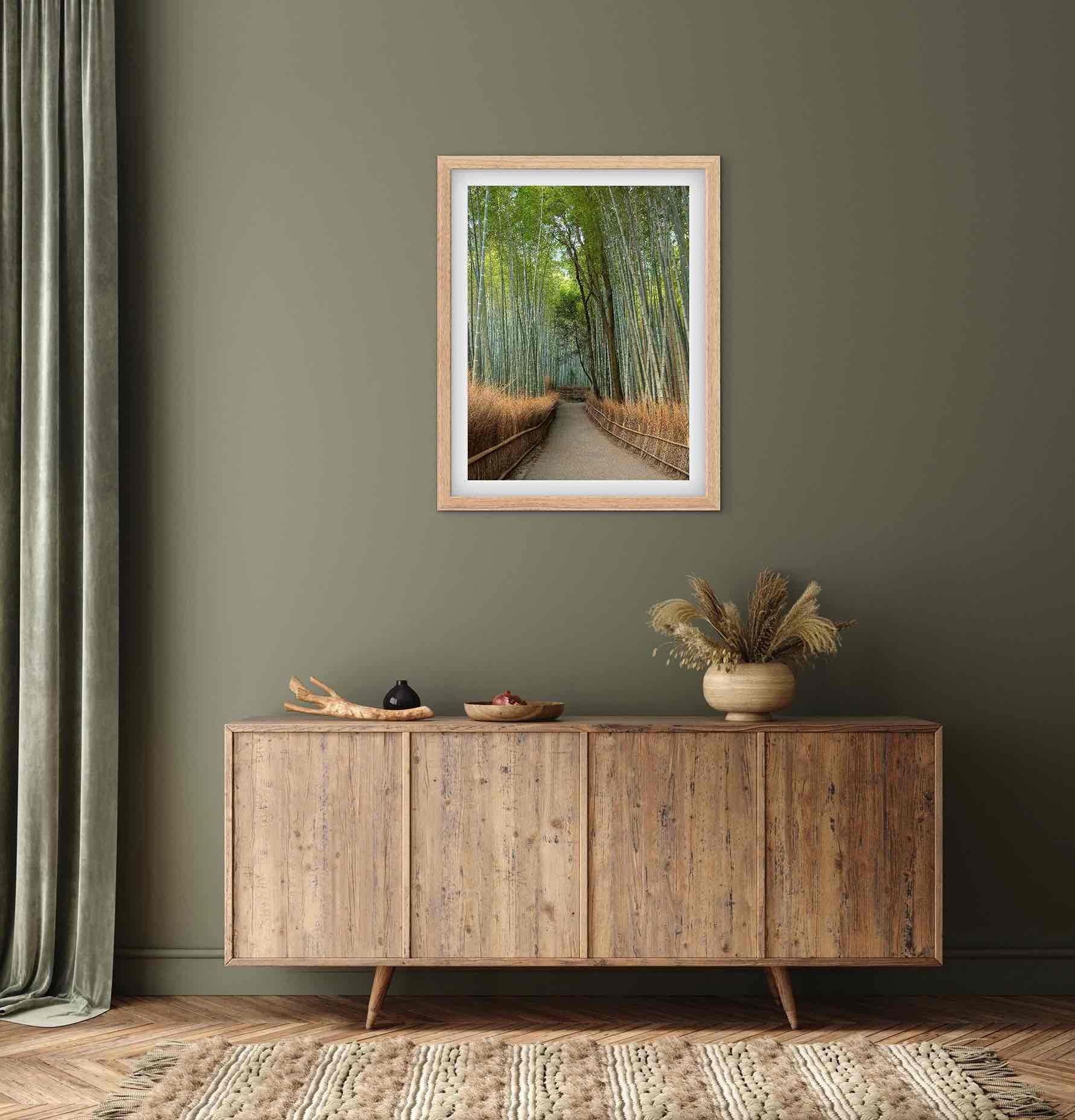 Framed Arashiyama Bamboo Grove Kyoto Japan bamboo forest wall art displayed above a wooden sideboard in a modern interior