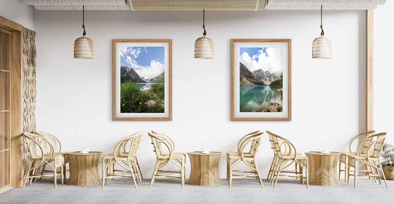Framed Lake Louise and Moraine Lake Canadian Rockies photography prints displayed together above a wooden sideboard