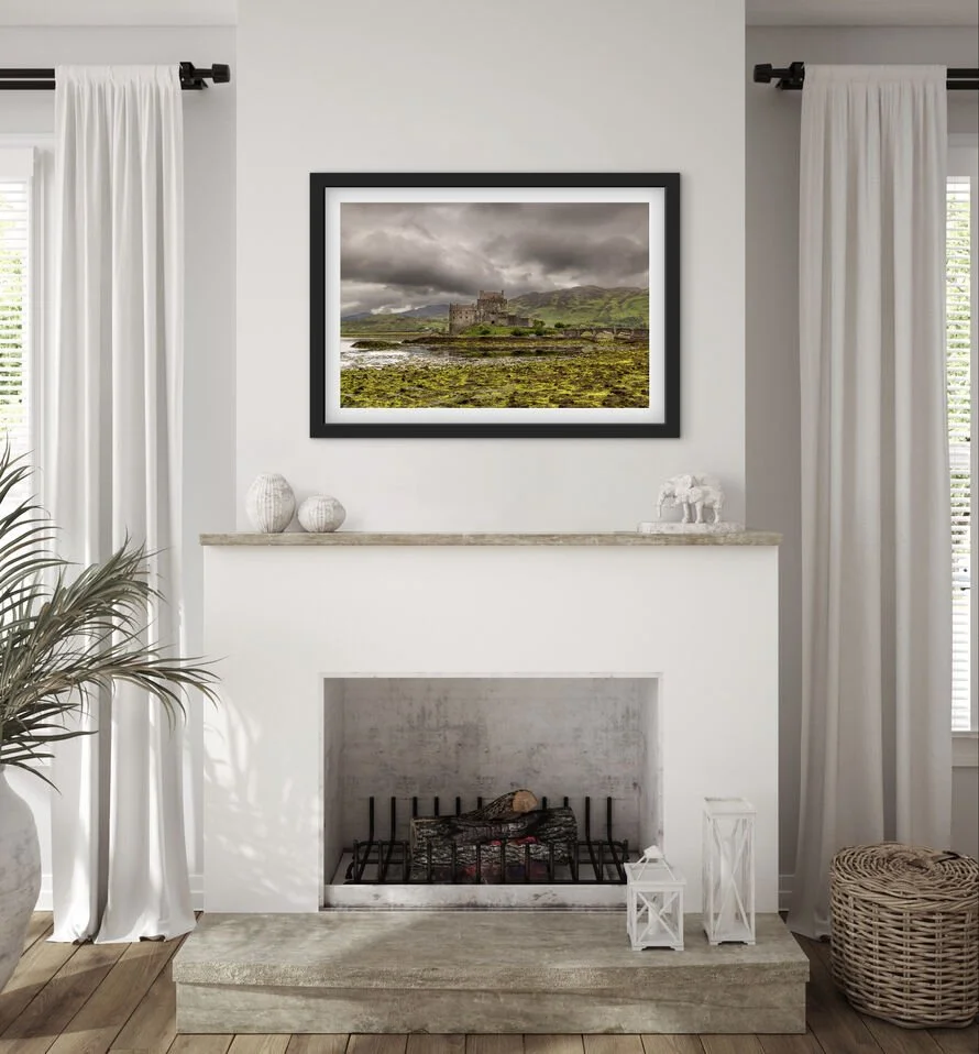 Framed Eilean Donan Castle Scottish Highlands landscape photograph displayed above a fireplace mantel