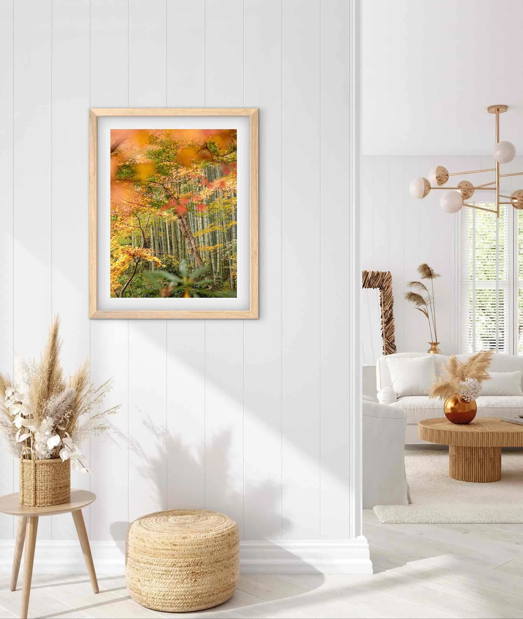 Framed Kyoto autumn foliage photography print from Sanzen-in Temple displayed on a light wall in a bright living space