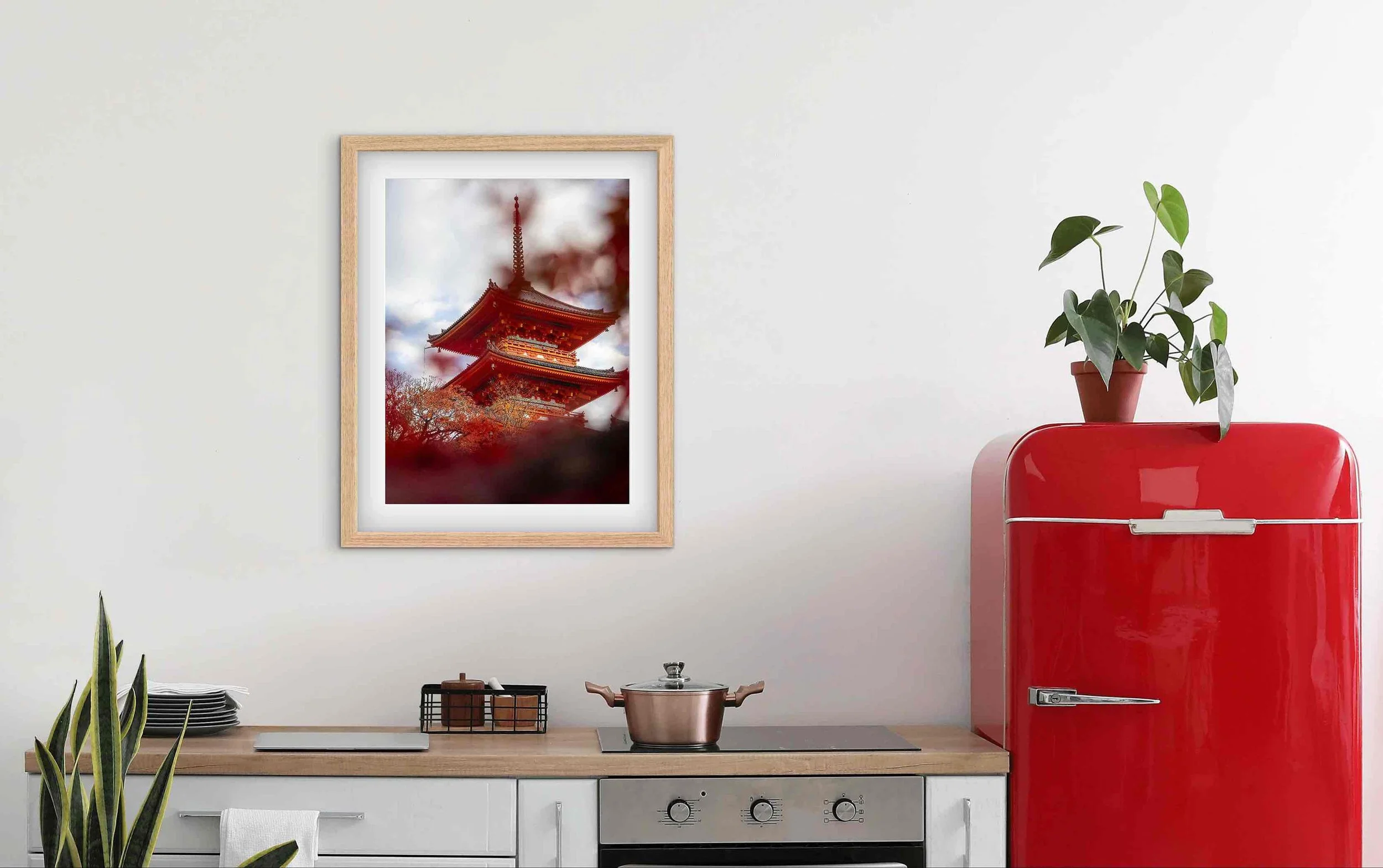 Framed Kiyomizu-dera Kyoto Japan pagoda photography print displayed in a modern kitchen interior beside a red refrigerator