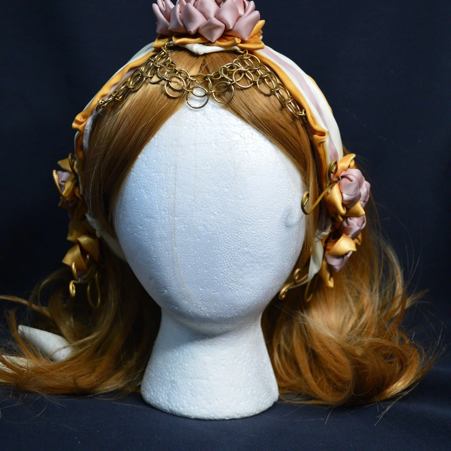 I can't believe I forgot to post this piece yet. I planned and made this piece for the 2025 Blossoms of Hope show. I taught myself how to make chainmail for this piece.

'Lotus in Waiting' 
Made with ribbon, felt, and brass wire.
Made in 2024

Would 