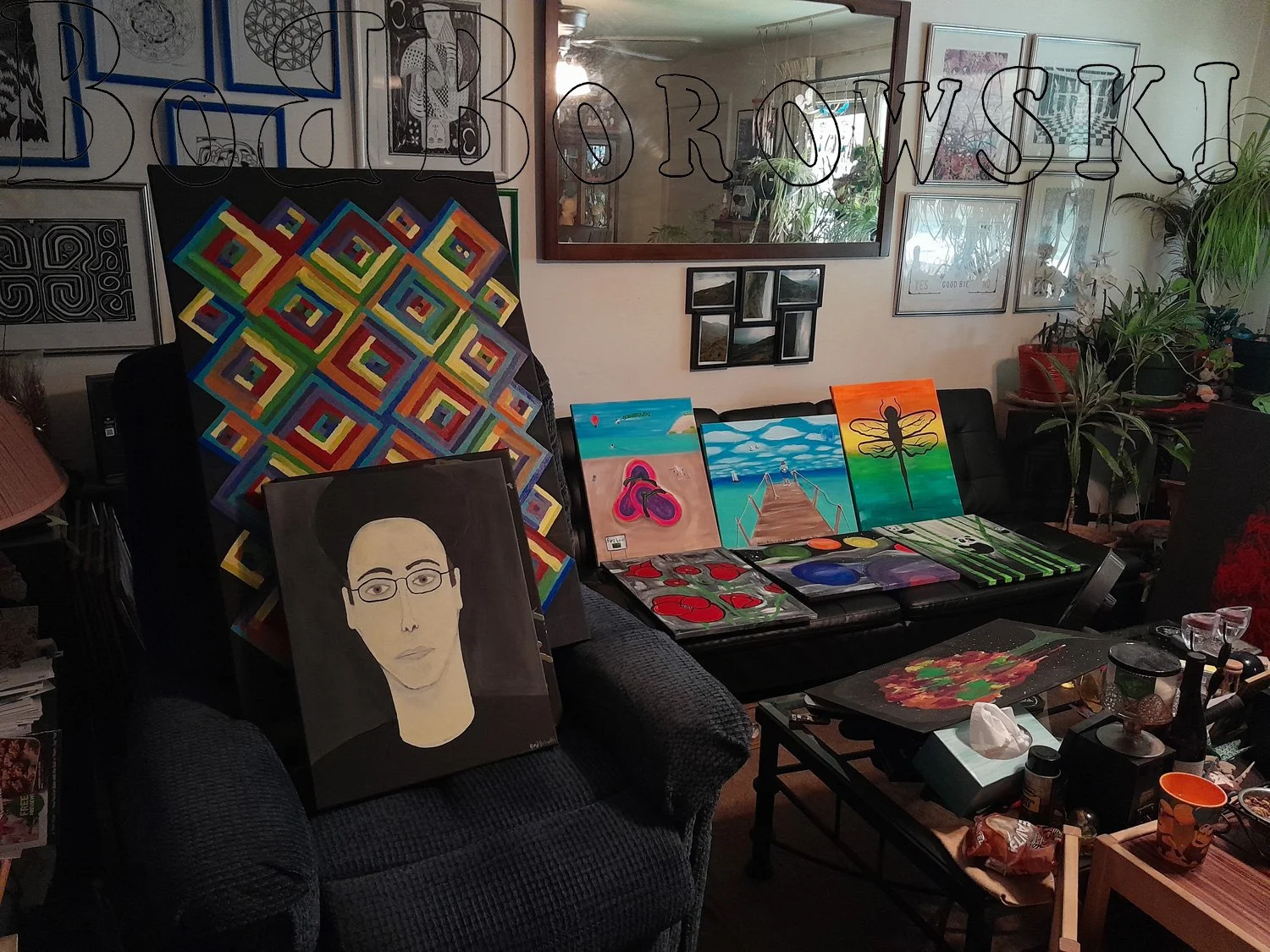 Collection of paintings and framed ink works.