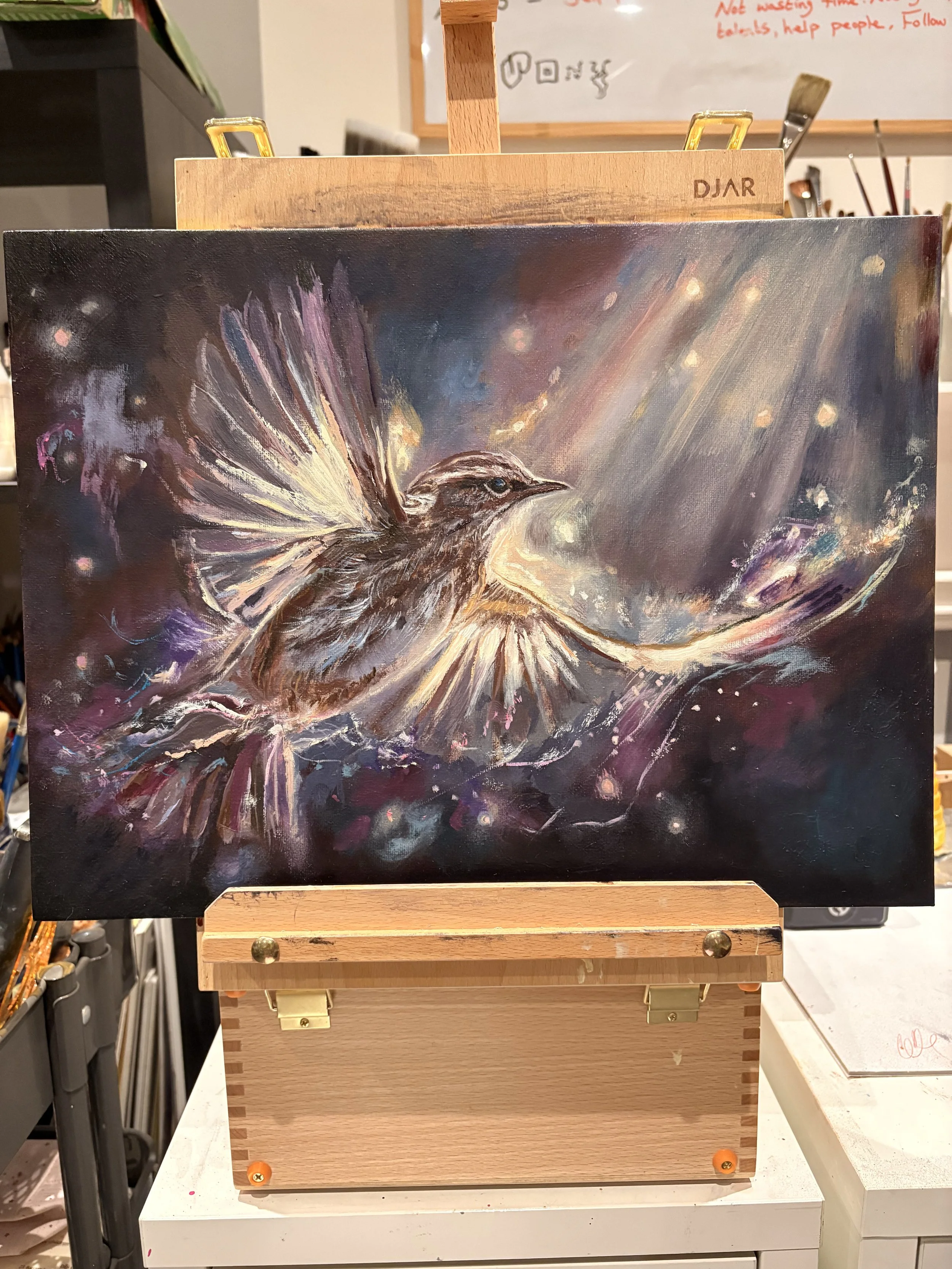 A colorful painting of a bird with glowing wings, flying through a cosmic, starry background.