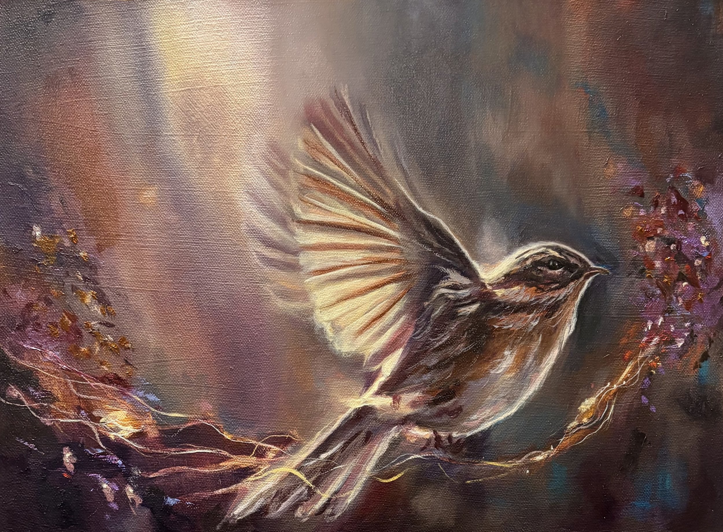 Spiritual bird artwork with golden light and branches. A painting of a small bird with brown and cream feathers, perched on a branch with purple flowers, set against a colourful, abstract background.