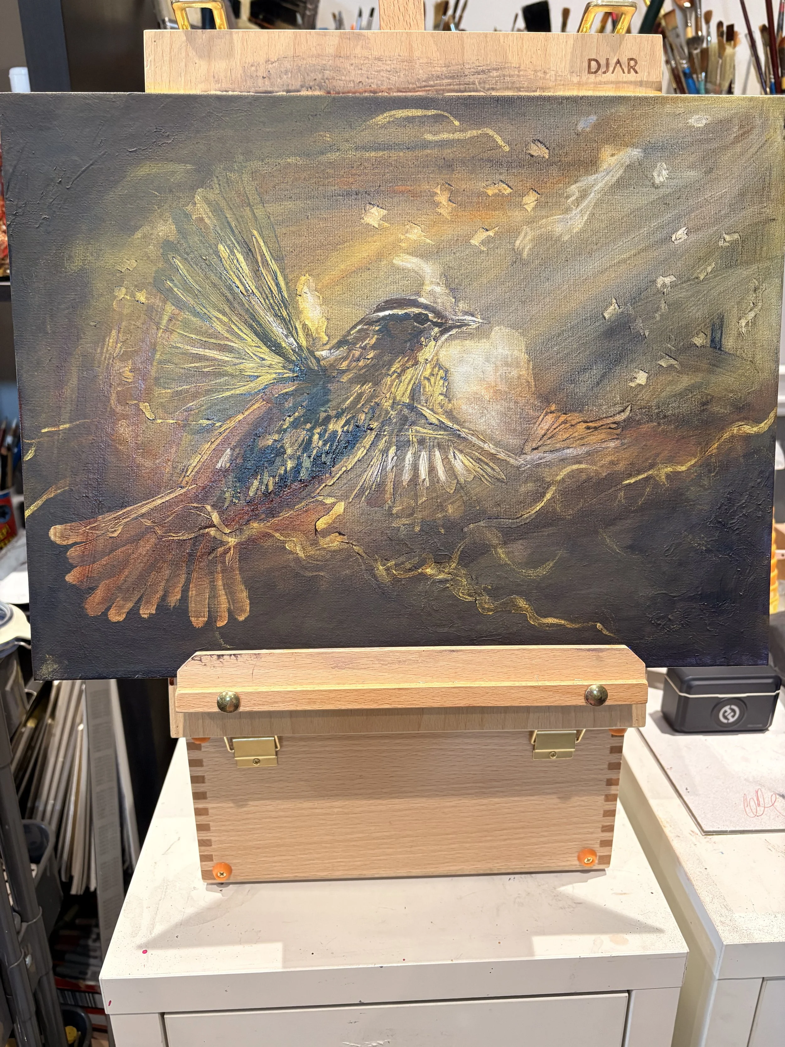 A painting of a bird with outstretched wings flying through a cloudy sky at sunset, with a full moon in the background.