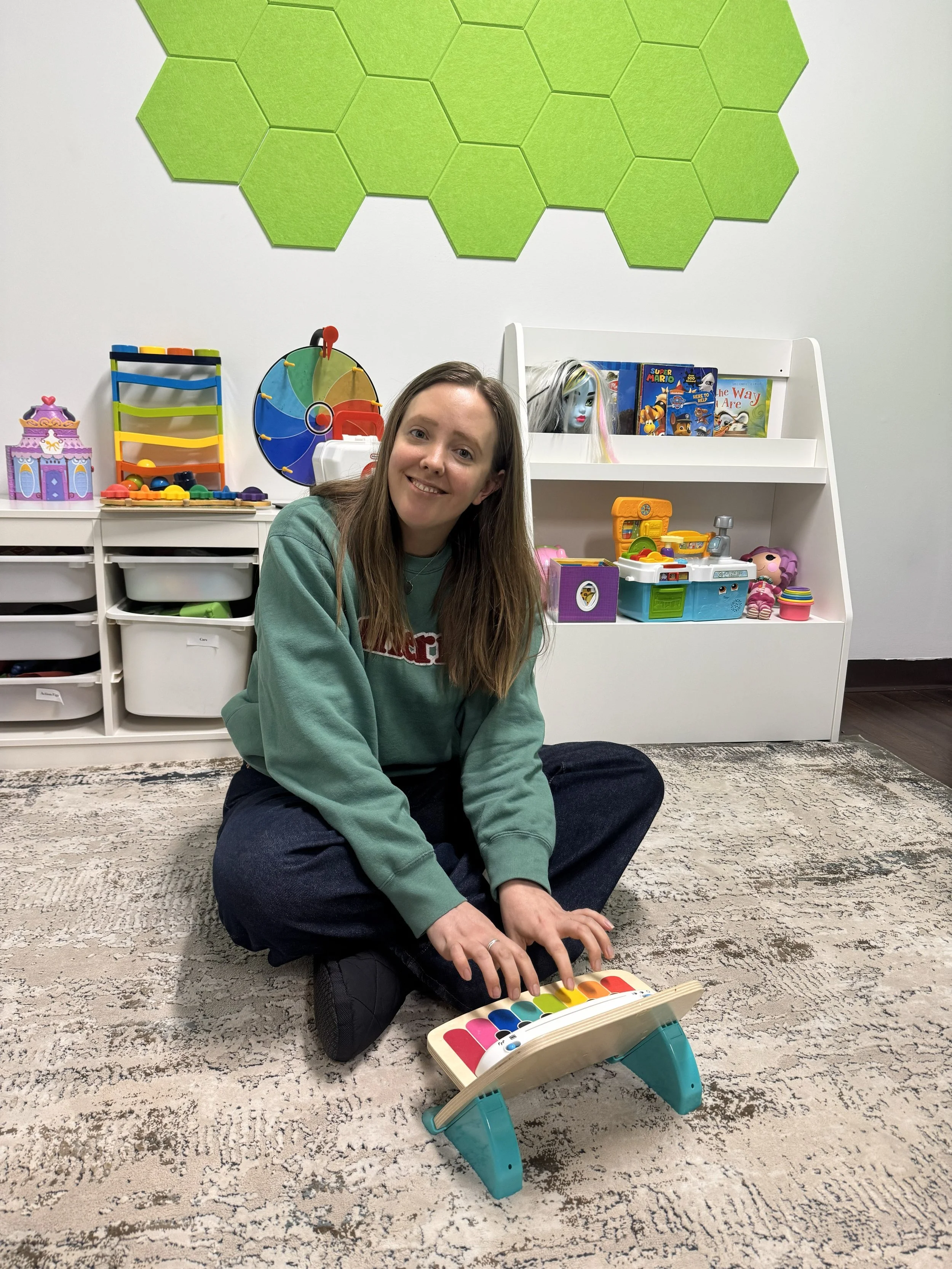 Frank practicing her musical skills at Main Street!