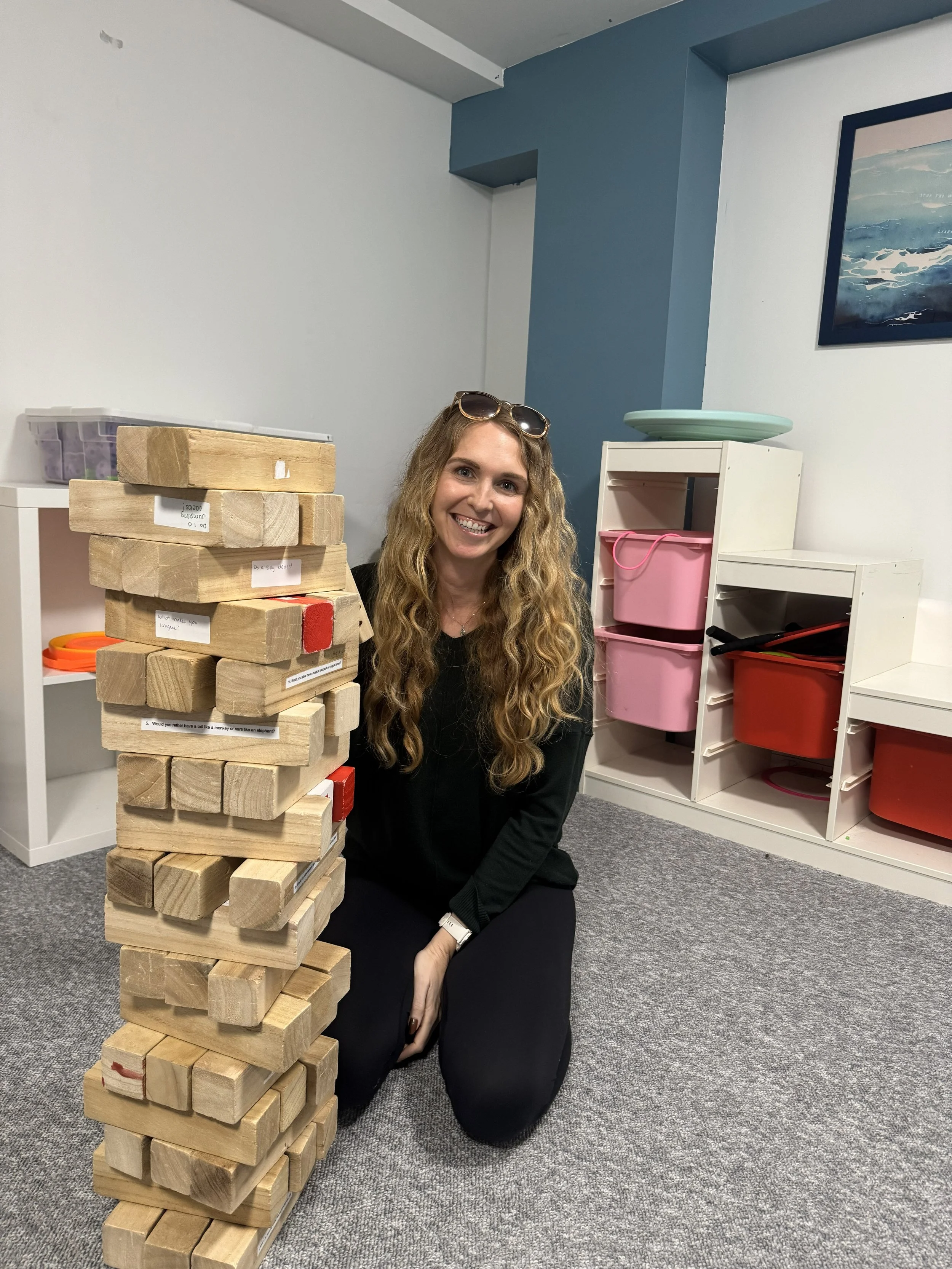 Andrea playing some giant Jenga at Main Street!