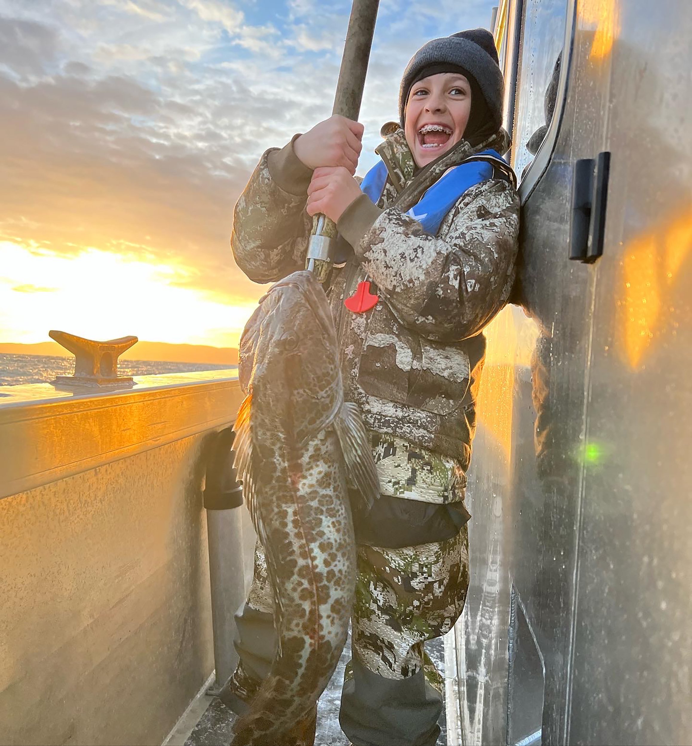 Kid with large lingcod