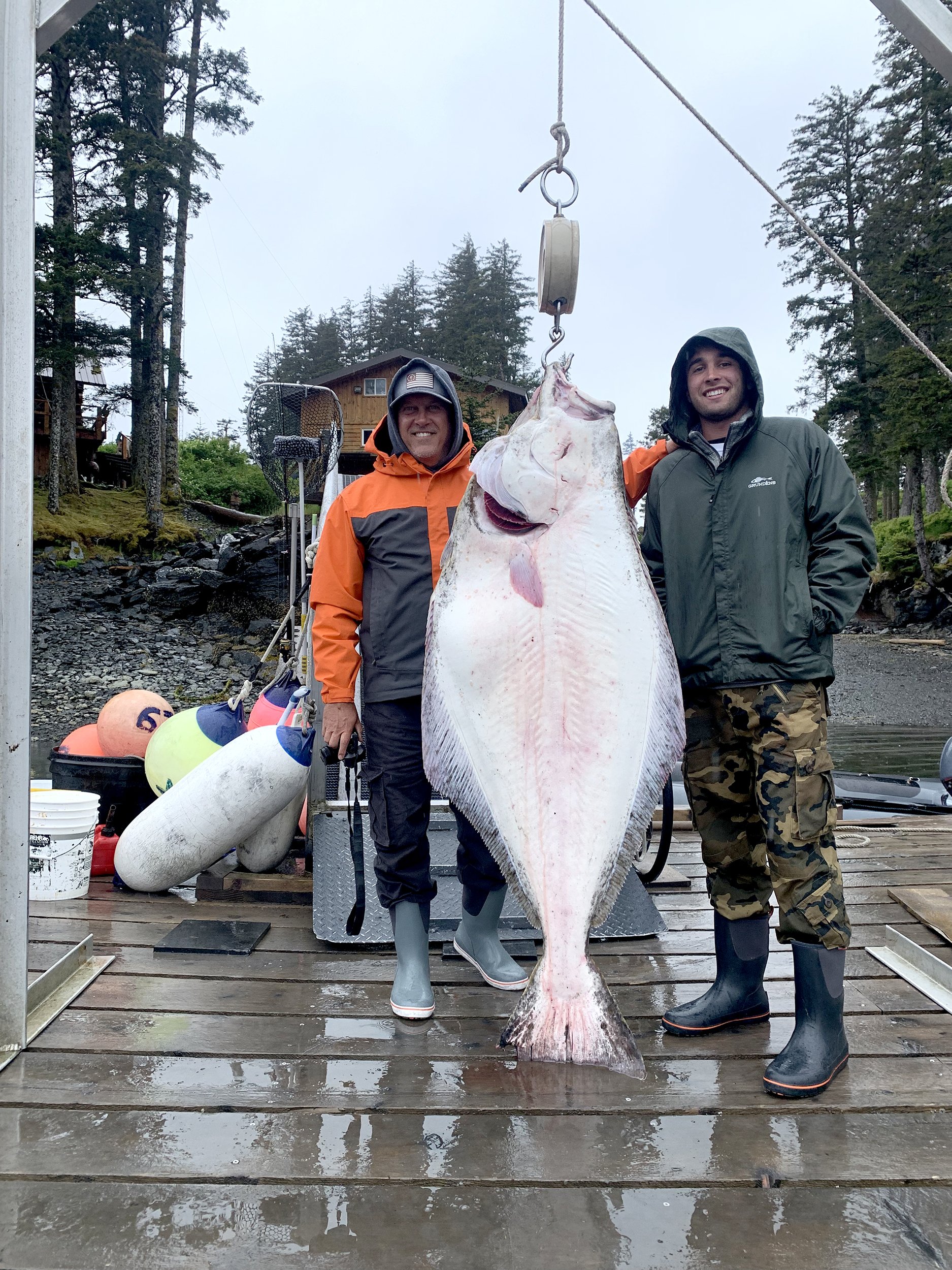 Father and son with halibut