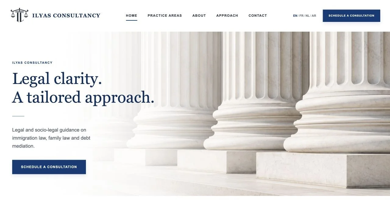 Live Ilyas Consultancy homepage with classical columns, navy typography and a consultation button.