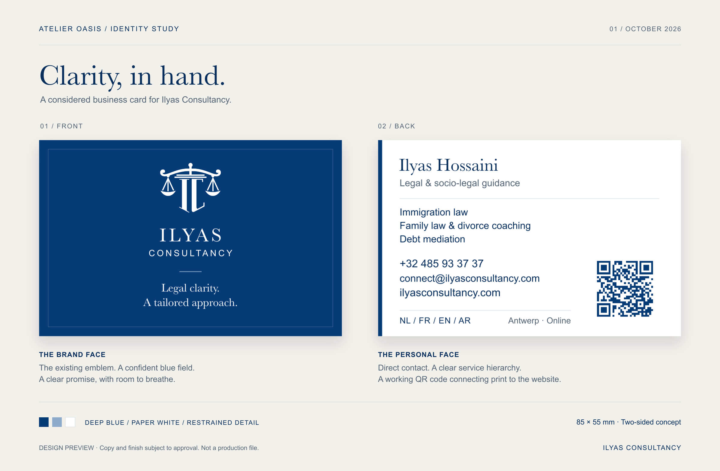 Proposed front and back of an Ilyas Consultancy business card, with navy emblem side and white contact side.