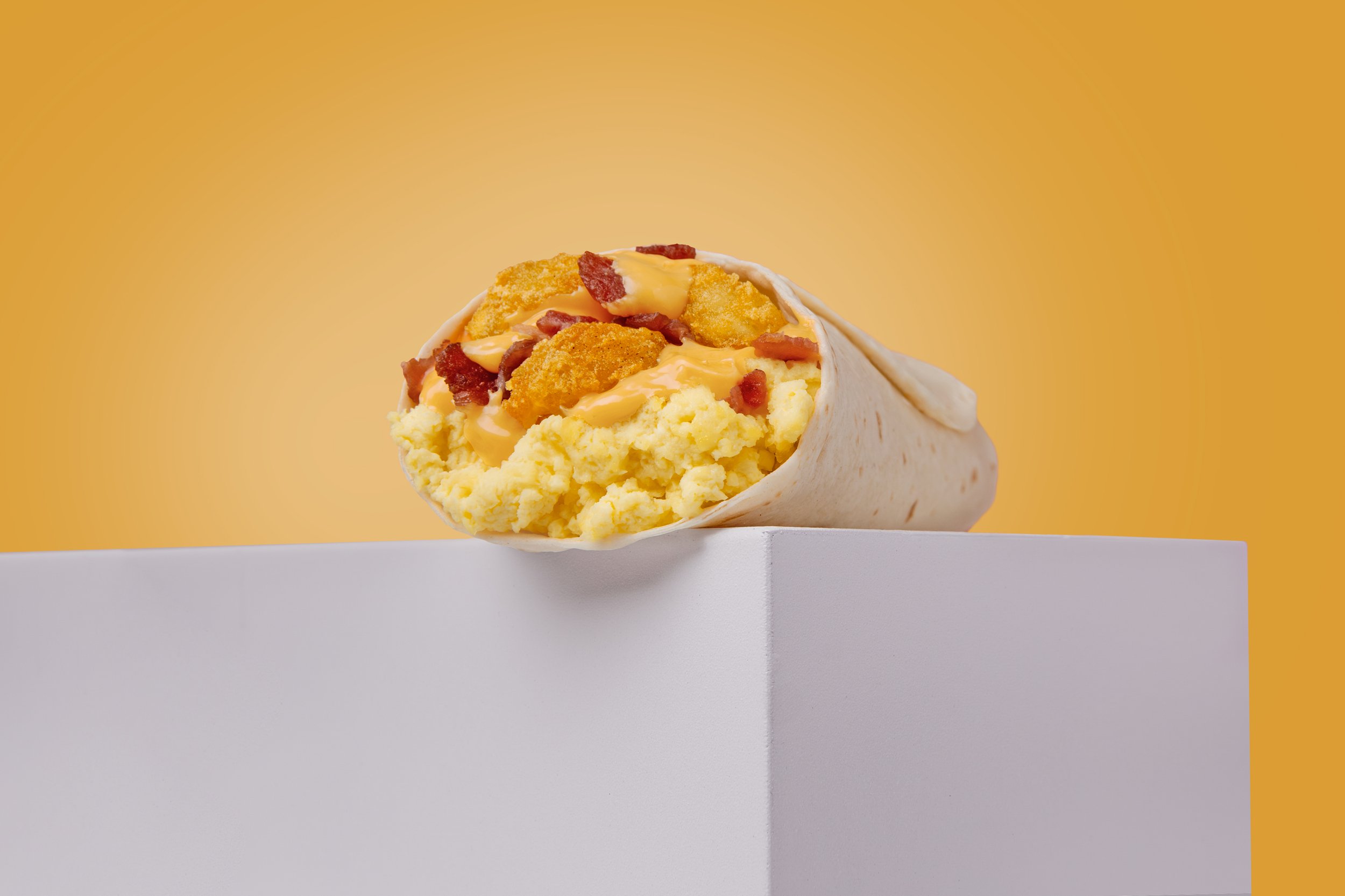 TJ25_P2_BigAngle_BreakfastBurrito_Bacon_RGB_GoldDust.jpg