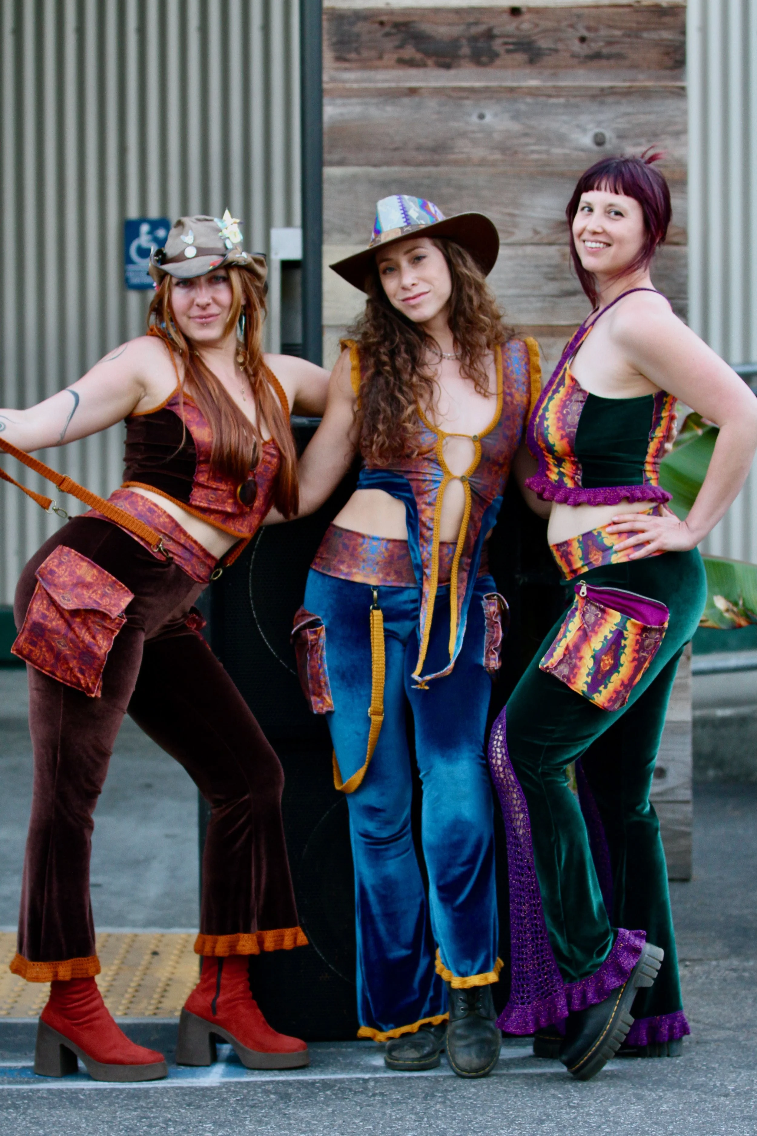 clothing designers wearing their outfits after our fashion show in 2025