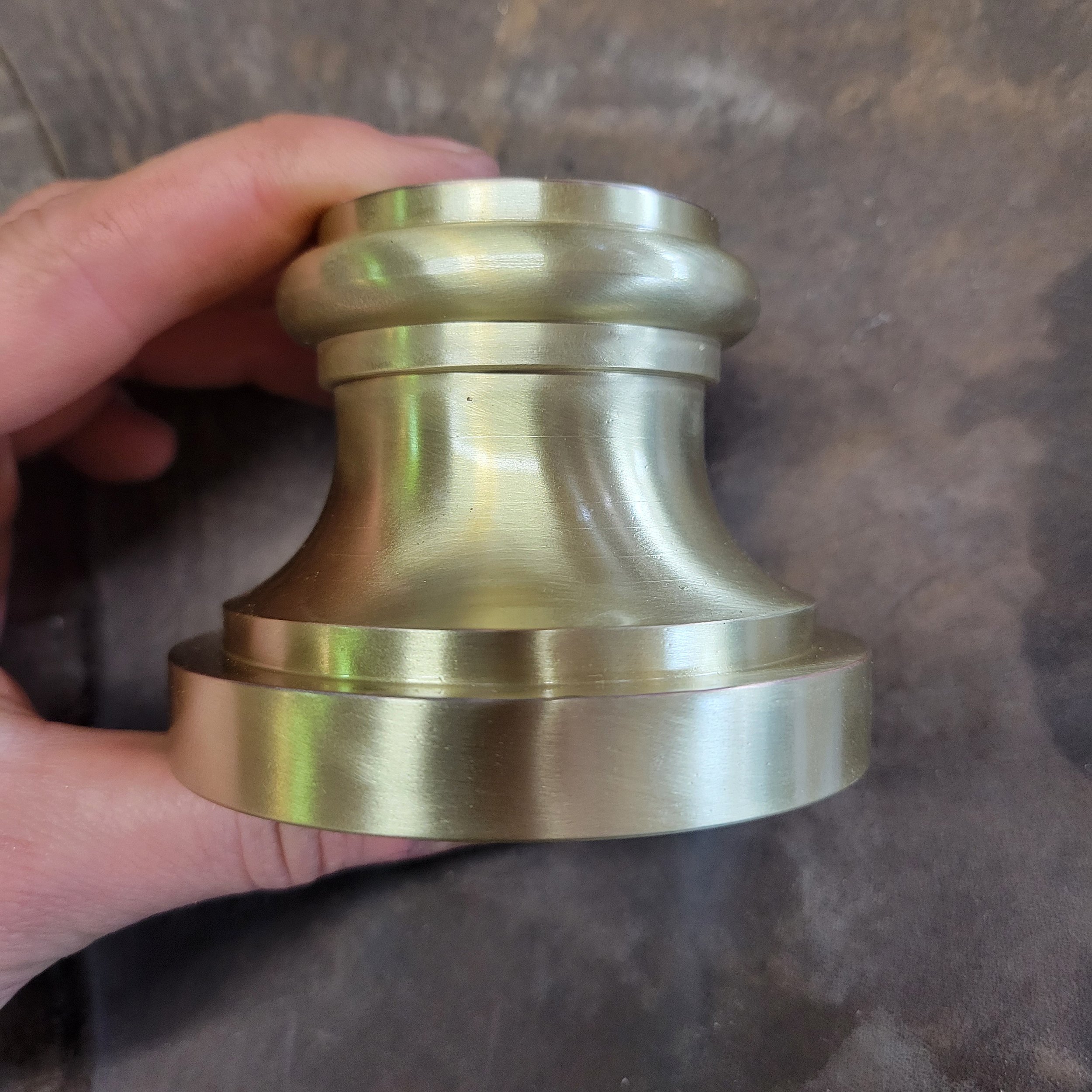 Brass plated stainless steel post "shoes" dress the base of each newel post.