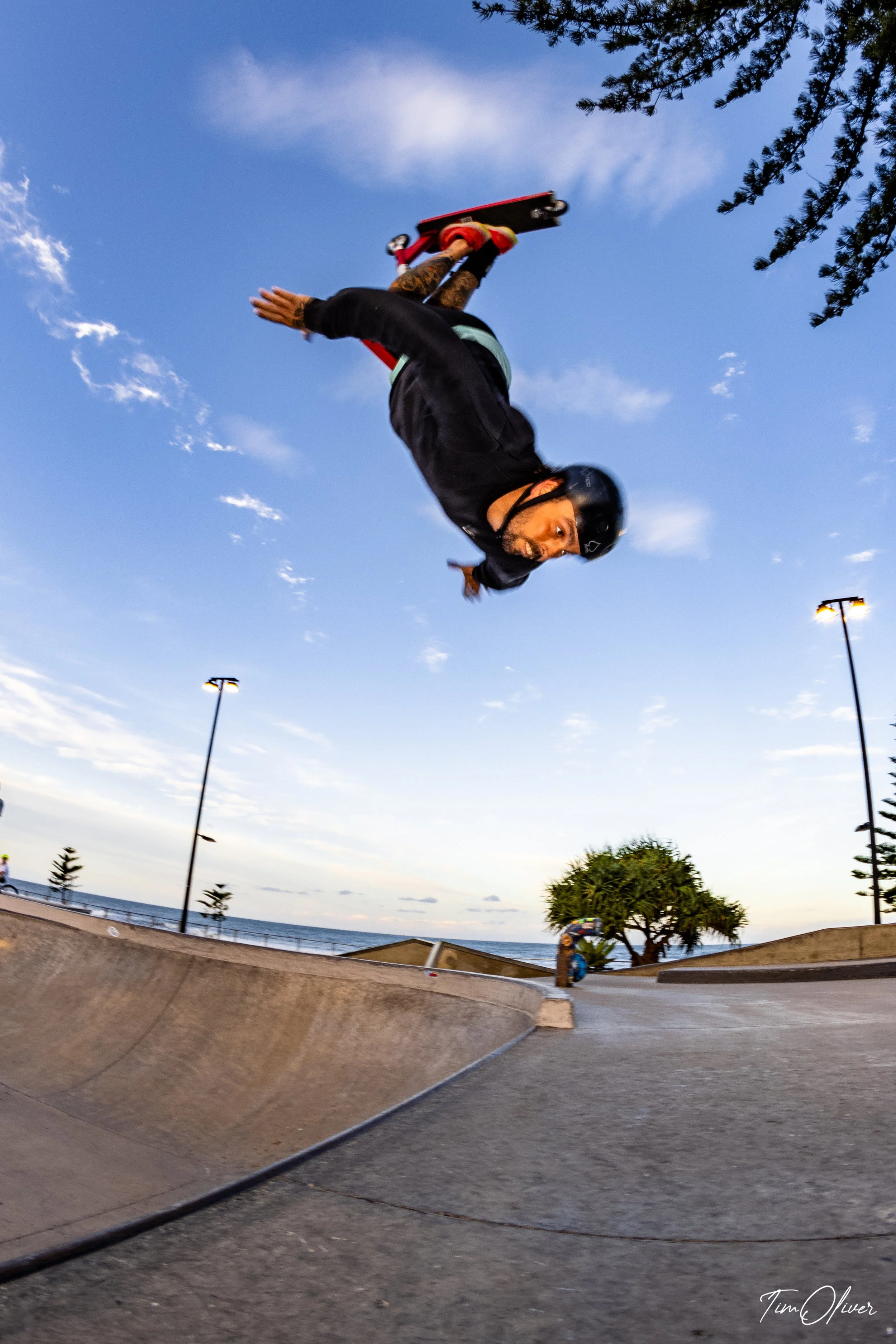 Jake Blackman flipping out of the bowl on his scooter at Alexandra Headland skatepark