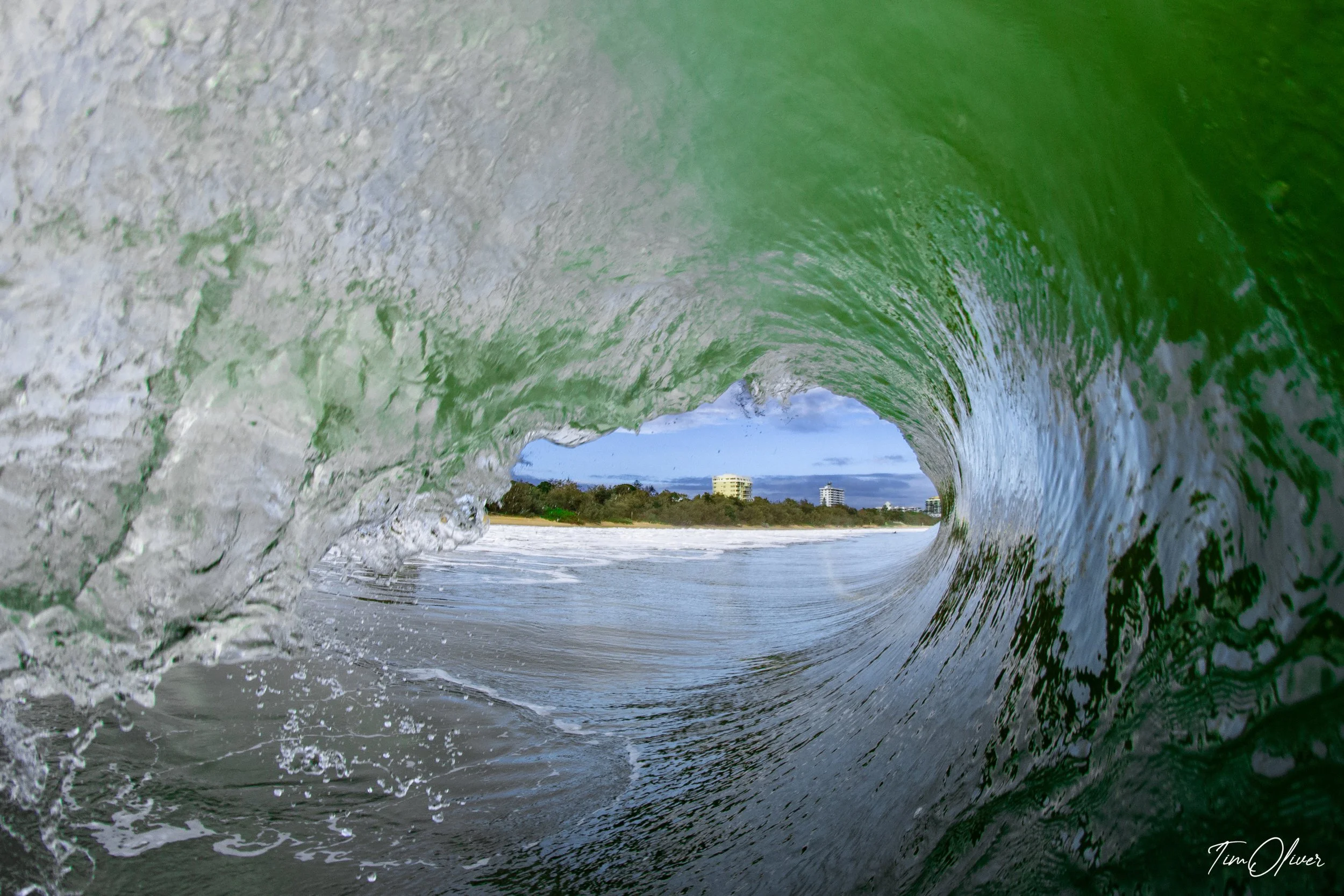 Photographer Tim Oliver capturing a beautiful wave at mooloolaba beach, QLD, Australia.
