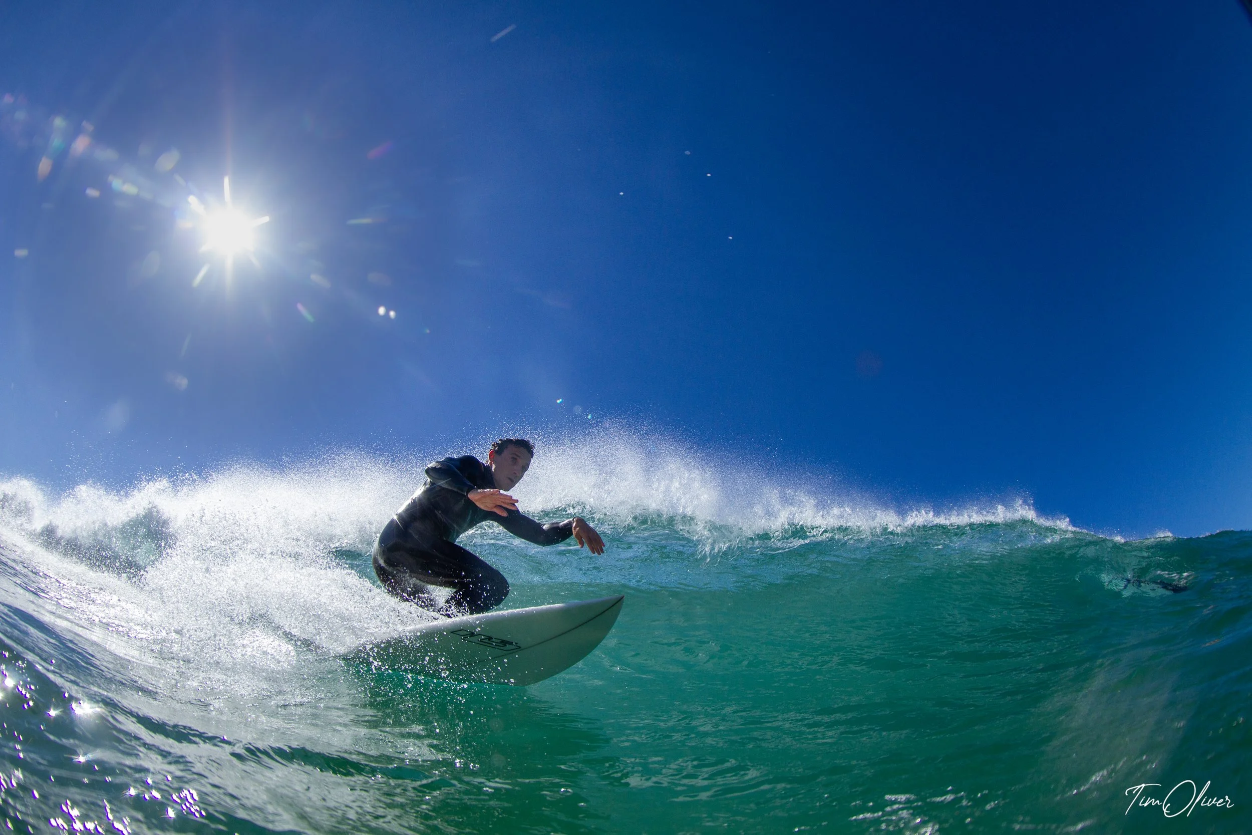 Low angle of a surfer taking off