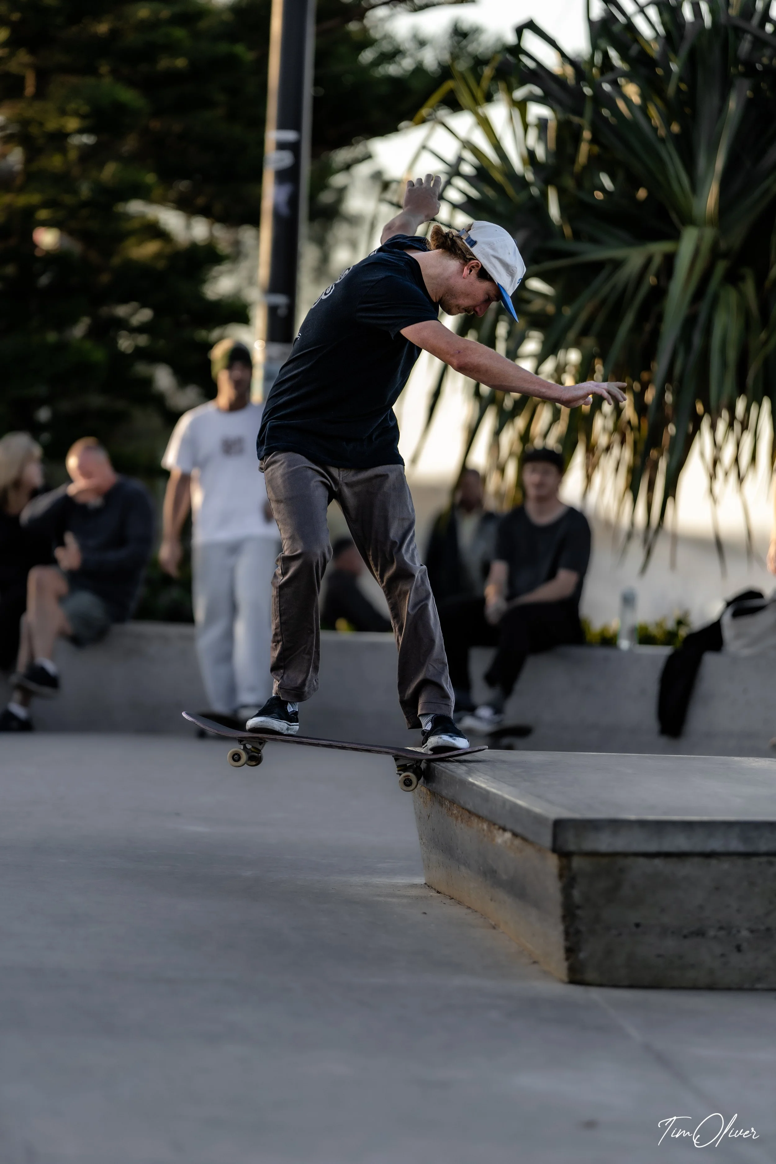 skateboarder at Alexandra Headland skate park doing a backside nose slide