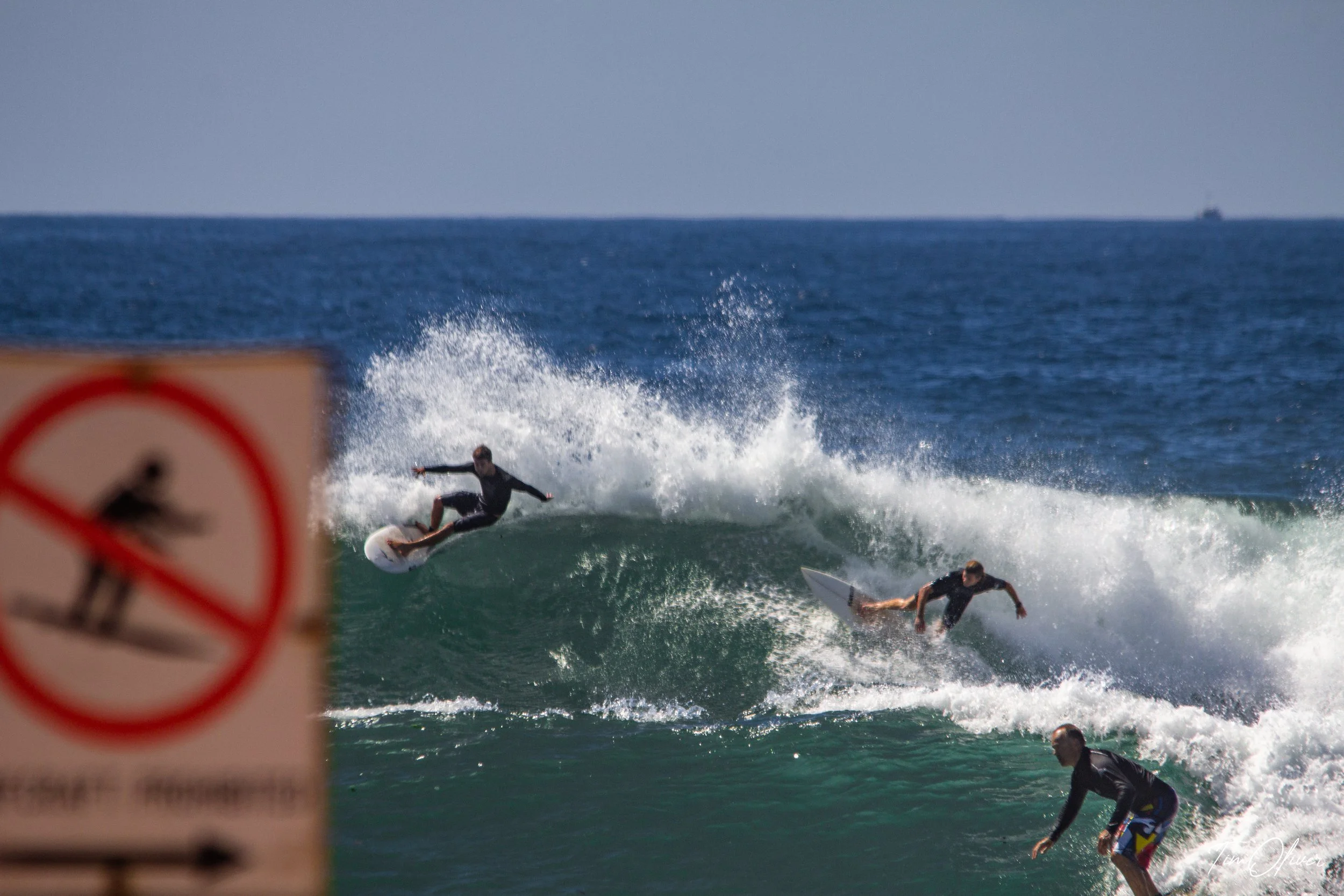Ironic surfers in no surfing area