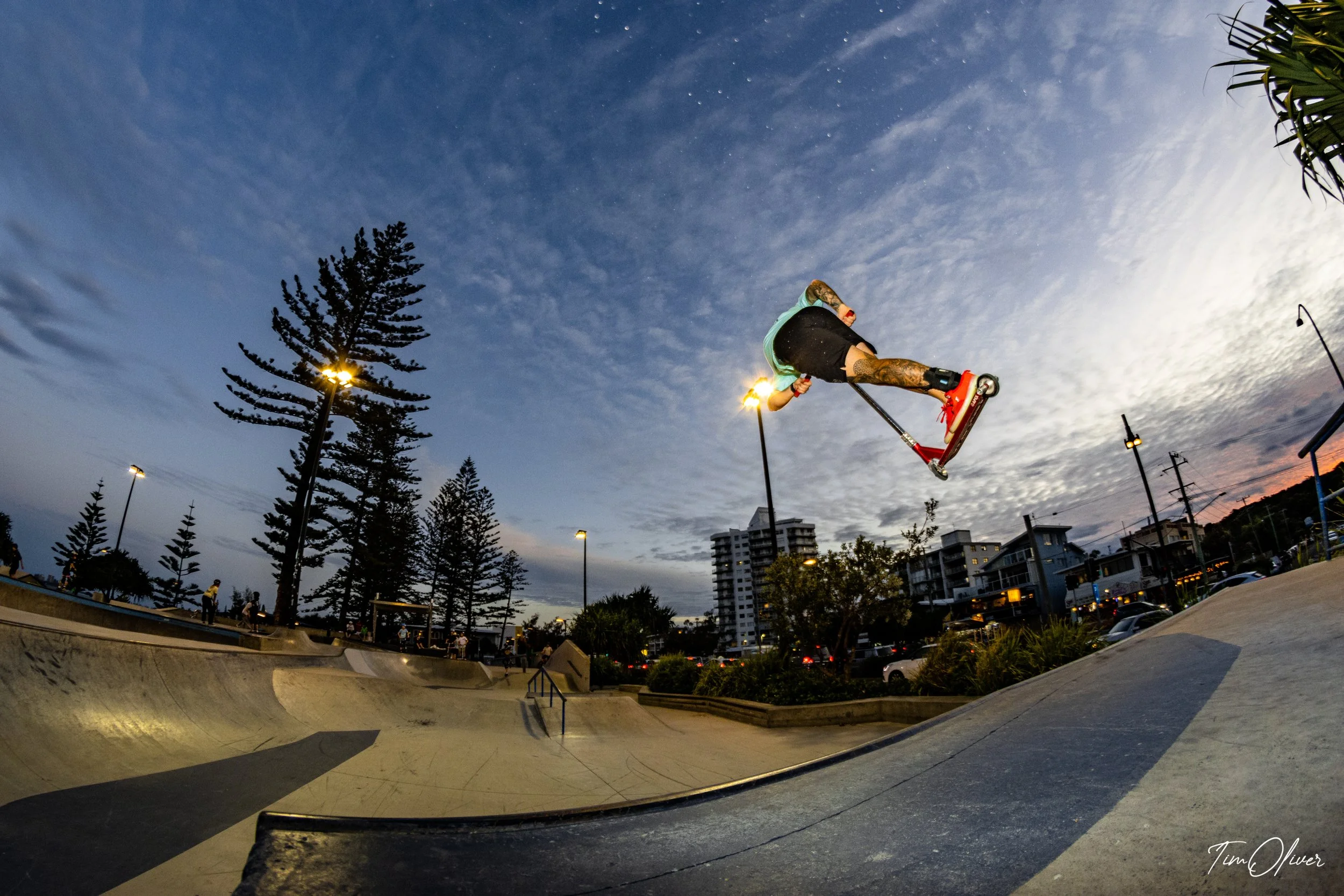 Jake Blackman boosting off the quarter on his scooter at Alexandra Headland skatepark