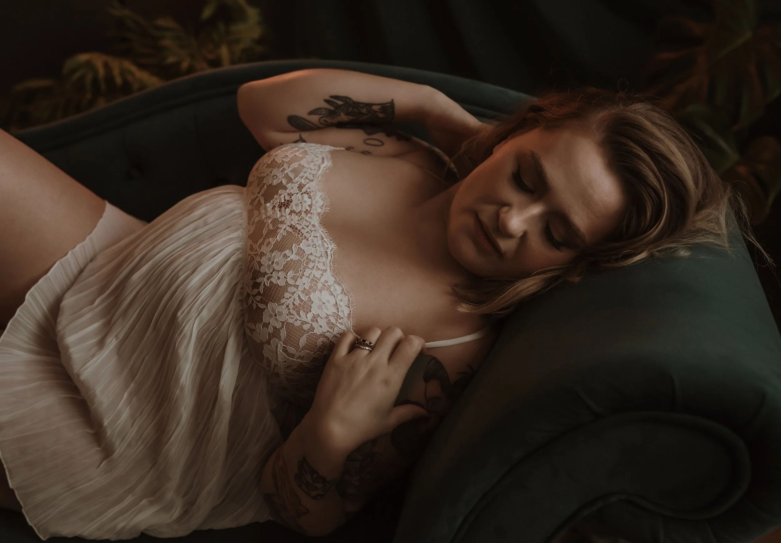 Close-up detail from a Glasgow boudoir photography session highlighting delicate lace lingerie and elegant, natural posing.