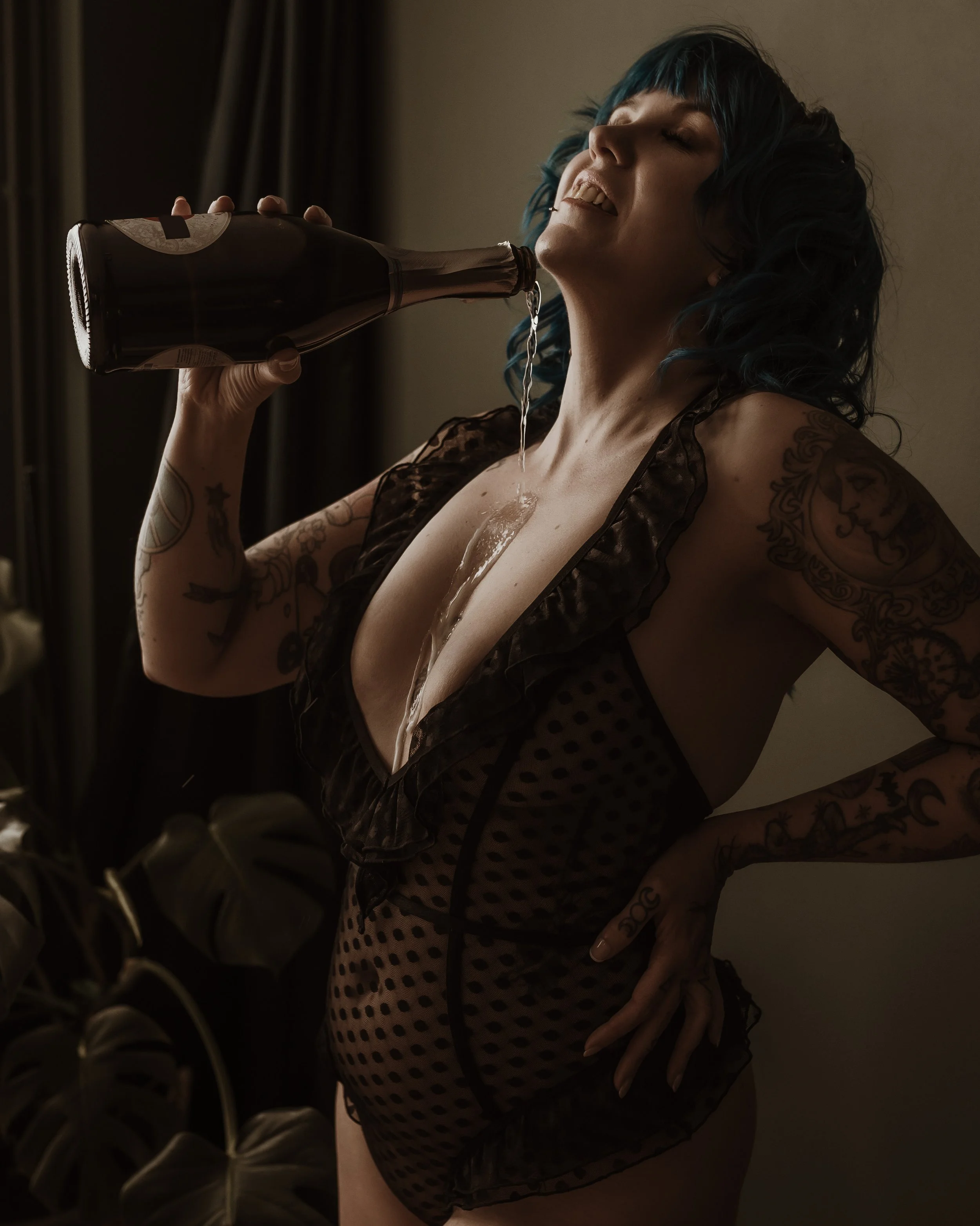 Champagne being poured during the Champagne Experience add-on at Marieke Captures, a playful studio boudoir session in Glasgow.